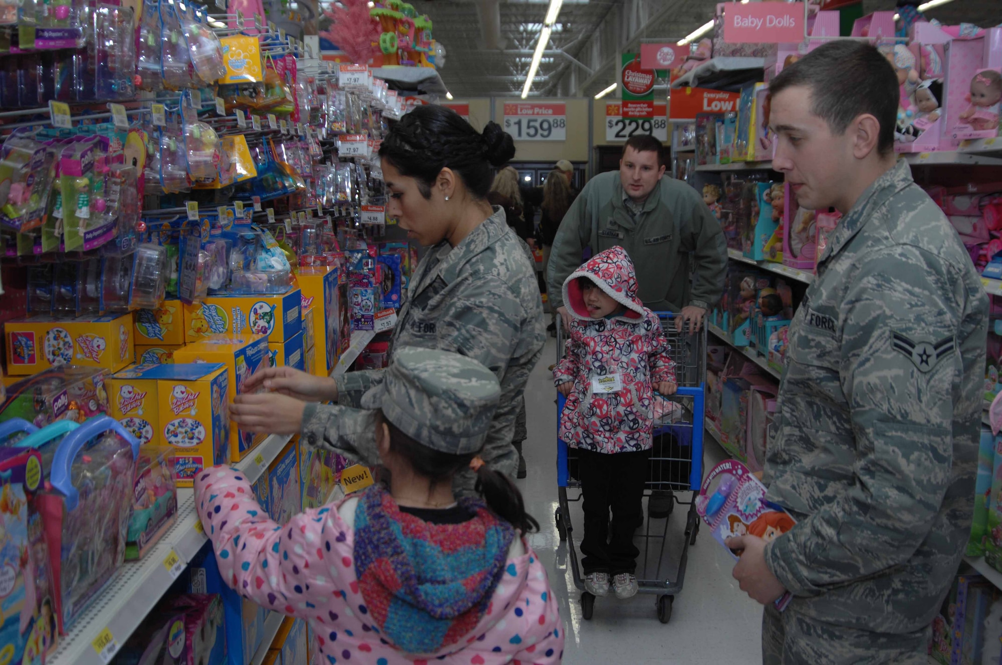 Members of the 366th Fighter Wing from Mountain Home Air Force Base, Idaho, participate in the 15th annual Shop with a Cop event in Mountain Home, Idaho, Dec. 3, 2011. The program is designed to help promote a positive civilian and military police force image in the local community while giving children the opportunity to enjoy a great holiday season. (U.S. Air Force photo by Senior Airman Benjamin Sutton)