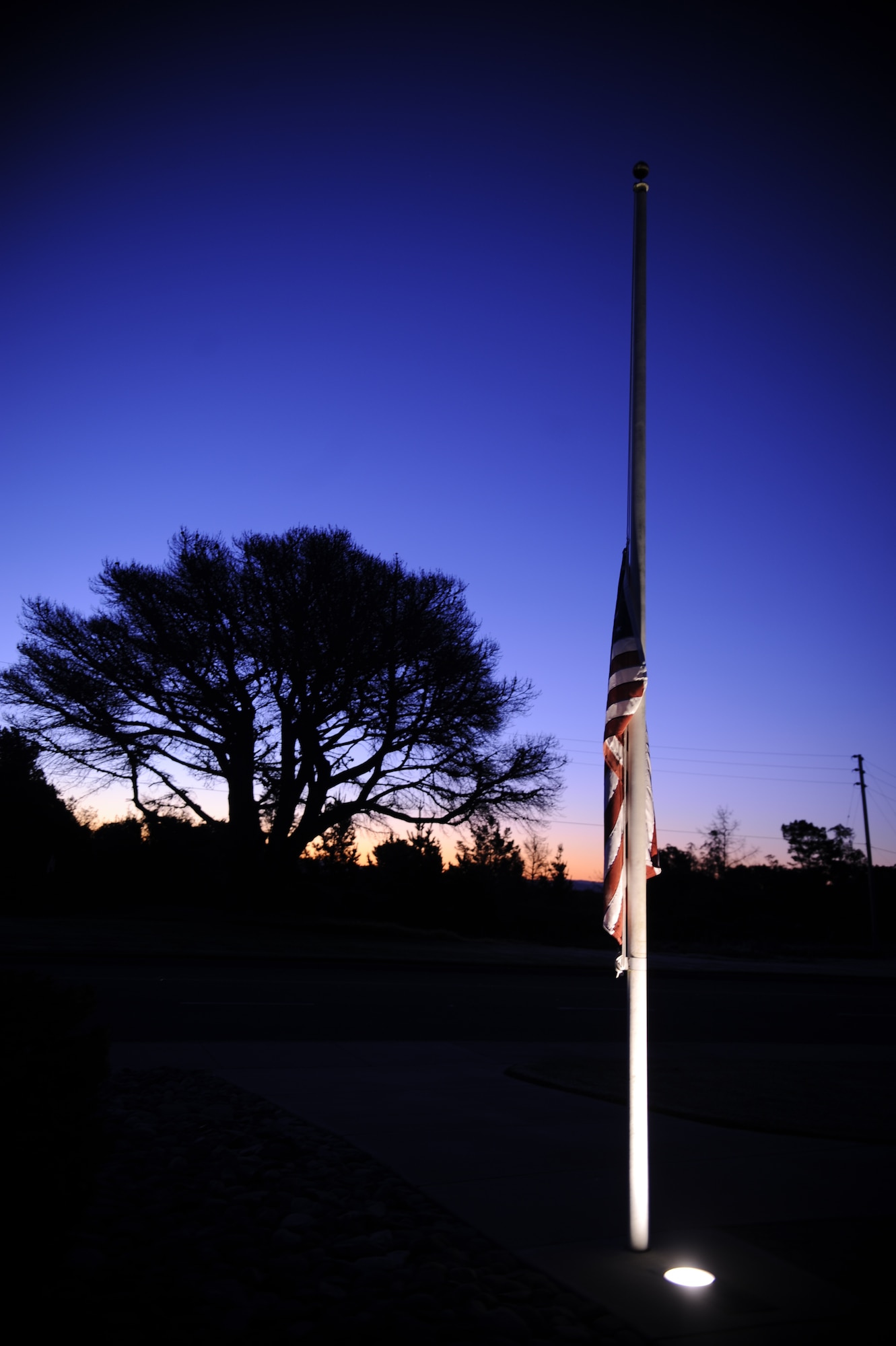 VANDENBERG AIR FORCE BASE, Calif. -- A U.S. flag is flown at half staff at Missile V here in honor of the 70th Anniversary of the attack at Pearl Harbor Wednesday, Dec. 7, 2011. The attacks caused the U.S. to enter into World War II.  (U.S. Air Force photo/Staff Sgt. Andrew Satran) 

  

 
 

 