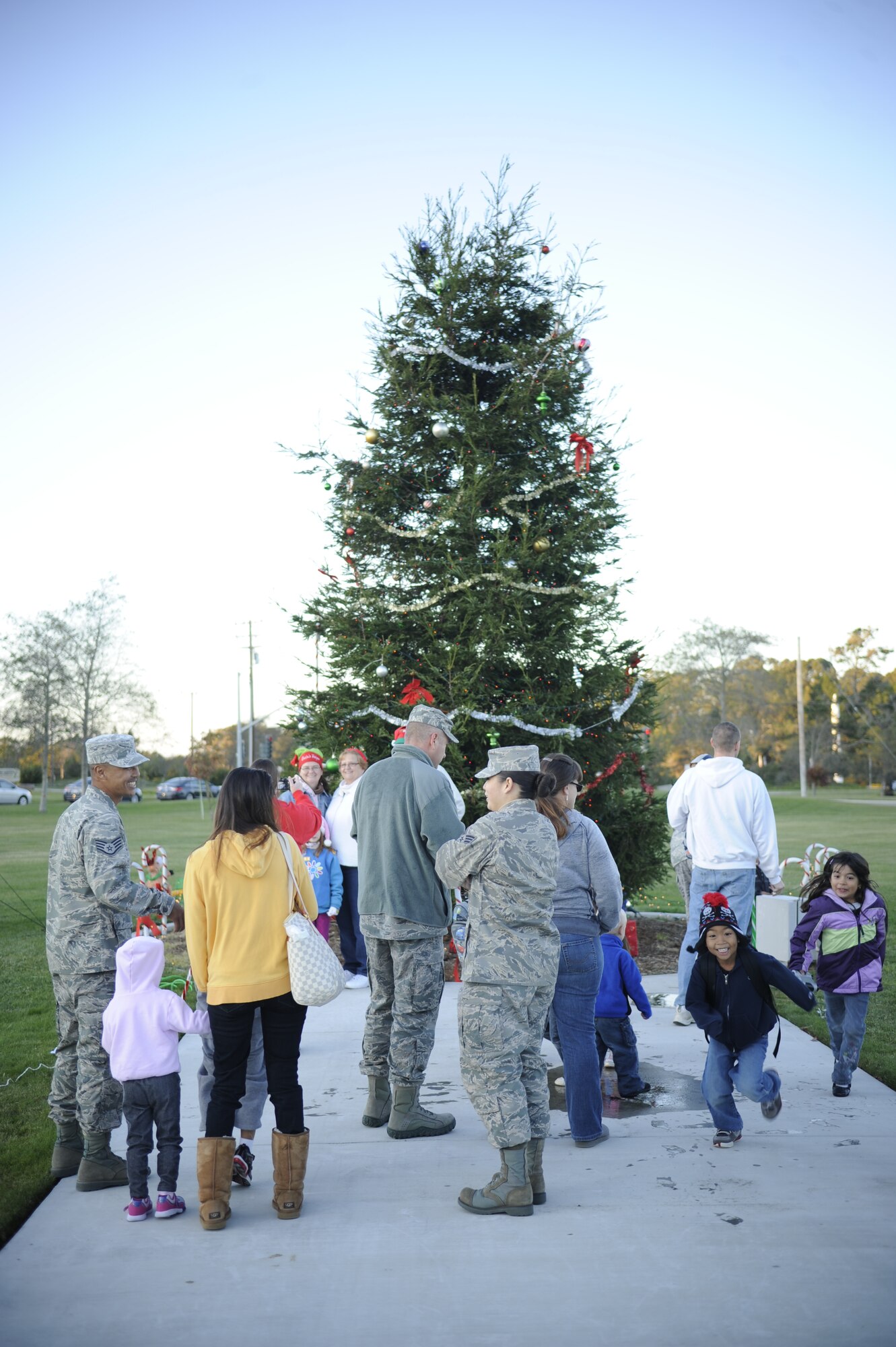 VANDENBERG AIR FORCE BASE, Calif. -- Team V members view the base tree during the base tree lighting event here Tuesday, Dec. 6, 2011.  The base celebrated the holidays with the lighting of the Christmas tree and a surprise visit from Santa. (U.S. Air Force photo/Staff Sgt. Andrew Satran) 

  
   