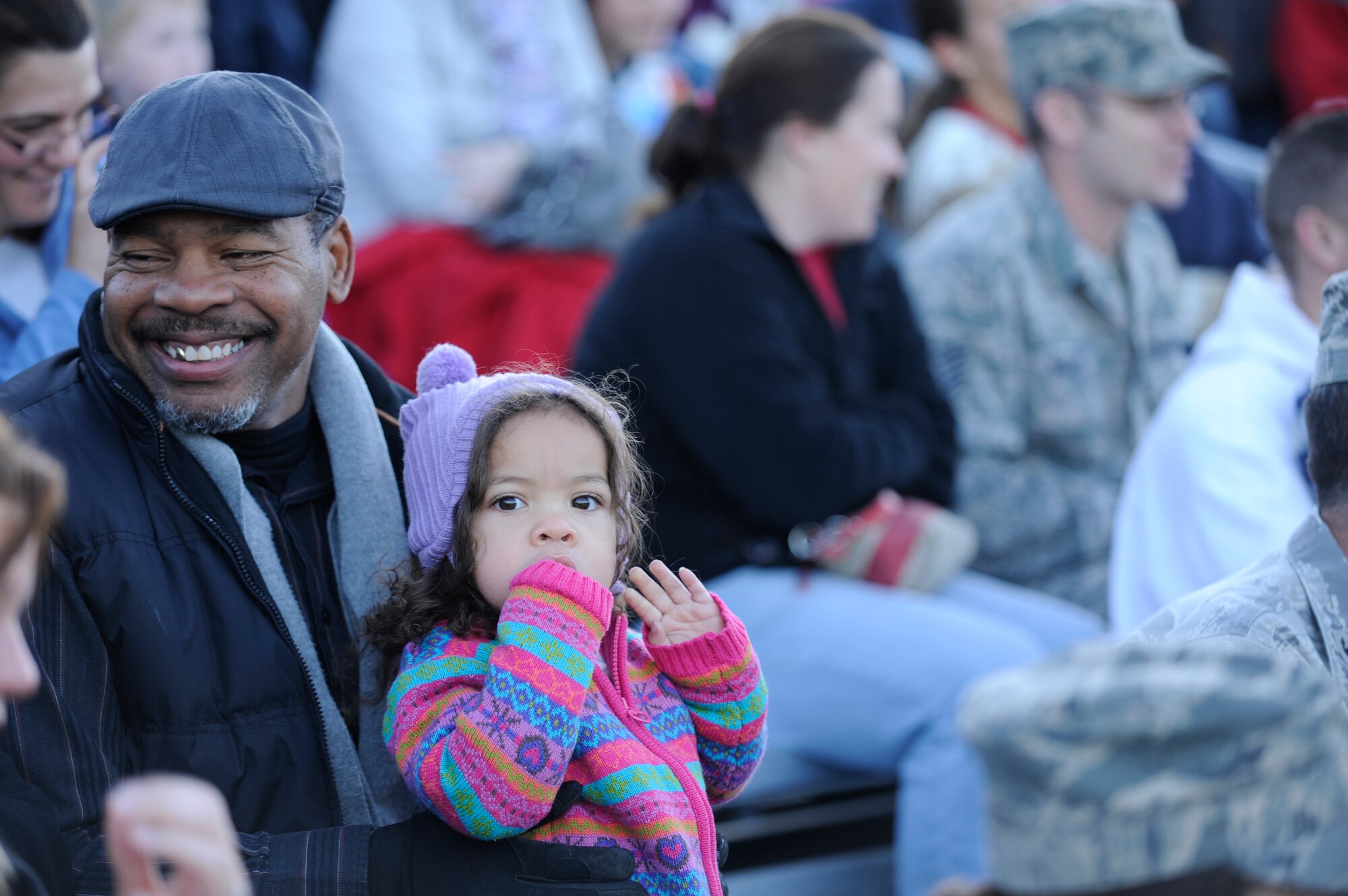 VANDENBERG AIR FORCE BASE, Calif. -- Team V members watch the tree light up during the base tree lighting event here Tuesday, Dec. 6, 2011.  The base celebrated the holidays with the lighting of the Christmas tree and a surprise visit from Santa. (U.S. Air Force photo/Staff Sgt. Andrew Satran) 

  