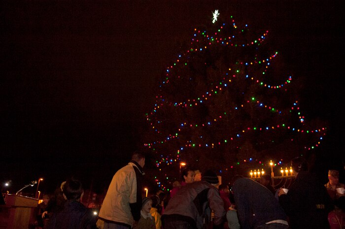 Nellis Air Force Base Airmen and their families gathered outside the base chapel to sing Christmas carols during the annual Menorah and Christmas tree lighting ceremony on Dec. 2, 2011. (U.S. Air Force photo by Airman 1st Class George Goslin)
