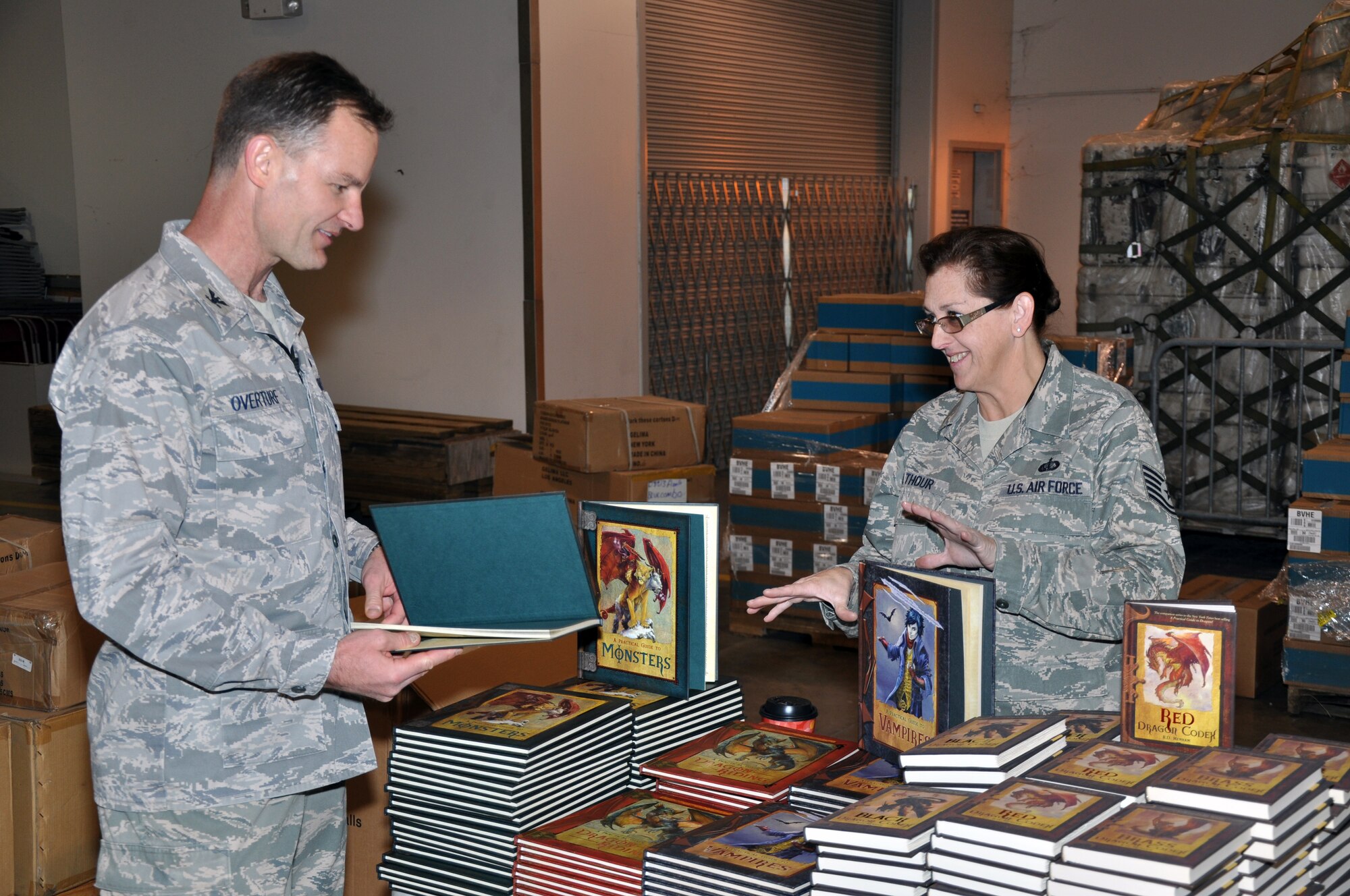 Col. Eric Overturf, 442nd Fighter Wing commander, talks to Tech. Sgt. Susan Walthour, 442nd Force Support Squadron, Dec. 3, 2011, at the 442nd Christmas Store. Walthour volunteered to assist with giving away donated items to Airmen. Everything at the store was free to Airmen and their families during the holiday season. The 442nd FW is an A-10 Thunderbolt II Air Force Reserve unit at Whiteman Air Force Base, Mo. (U.S. Air Force photo/Tech. Sgt. Kent Kagarise)