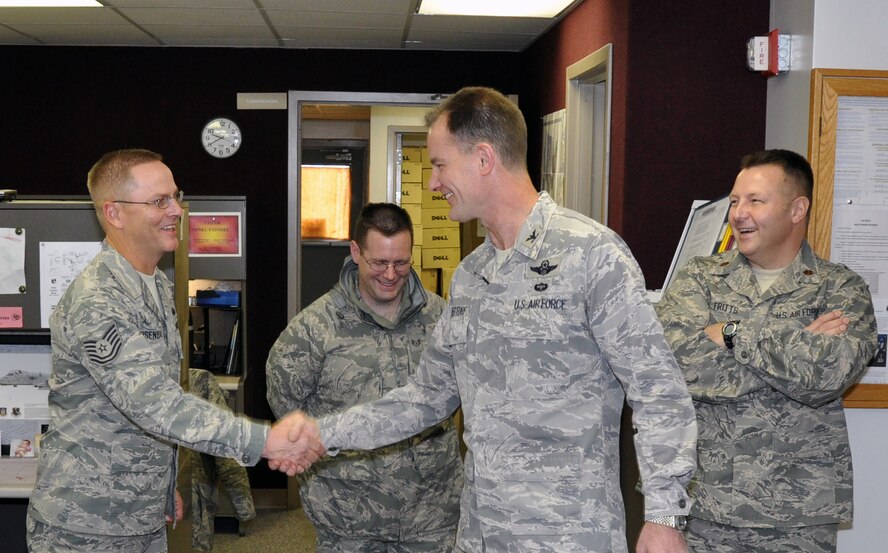 Col. Eric Overturf, 442nd Fighter Wing commander, talks to Tech. Sgt. Matthew Eisenbarth, 442nd Communications Flight technician, Dec. 3, 2011, about the CF restructuring scheduled to take place, Jan. 1, 2012. The CF will fall under the 442nd Force Support Squadron, commanded by Maj. Joe Walter. The 442nd FW is an A-10 Thunderbolt II Air Force Reserve unit at Whiteman Air Force Base, Mo. (U.S. Air Force photo/Tech. Sgt. Kent Kagarise)
