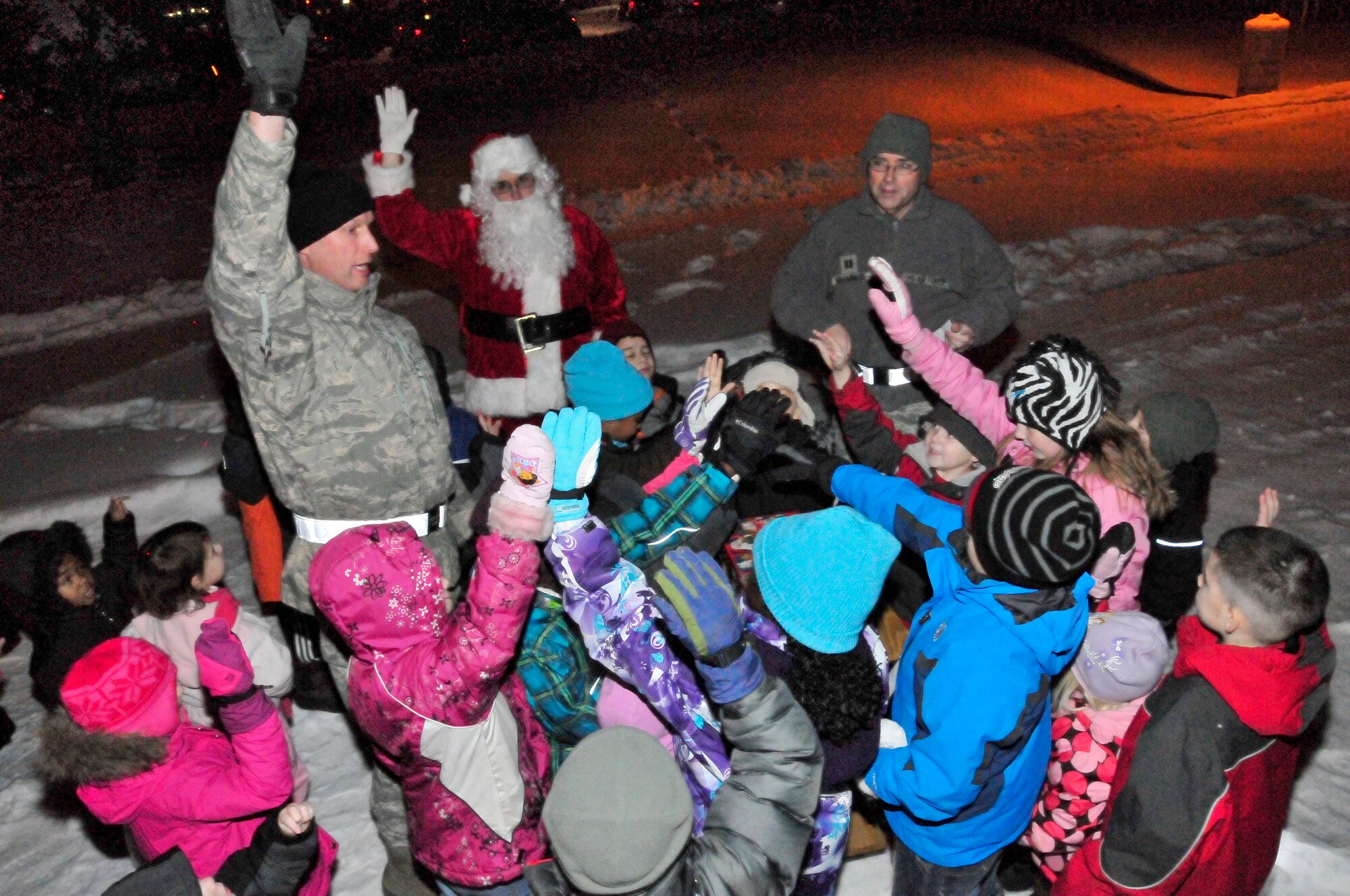 Brig. Gen. James Post, 354th Fighter Wing commander, along with Eielson children prepare to light the base holiday tree at the base chapel Dec. 1, 2011, Eielson Air Force Base, Alaska.  (U.S. Air Force photo/Staff Sgt. Miguel Lara III)