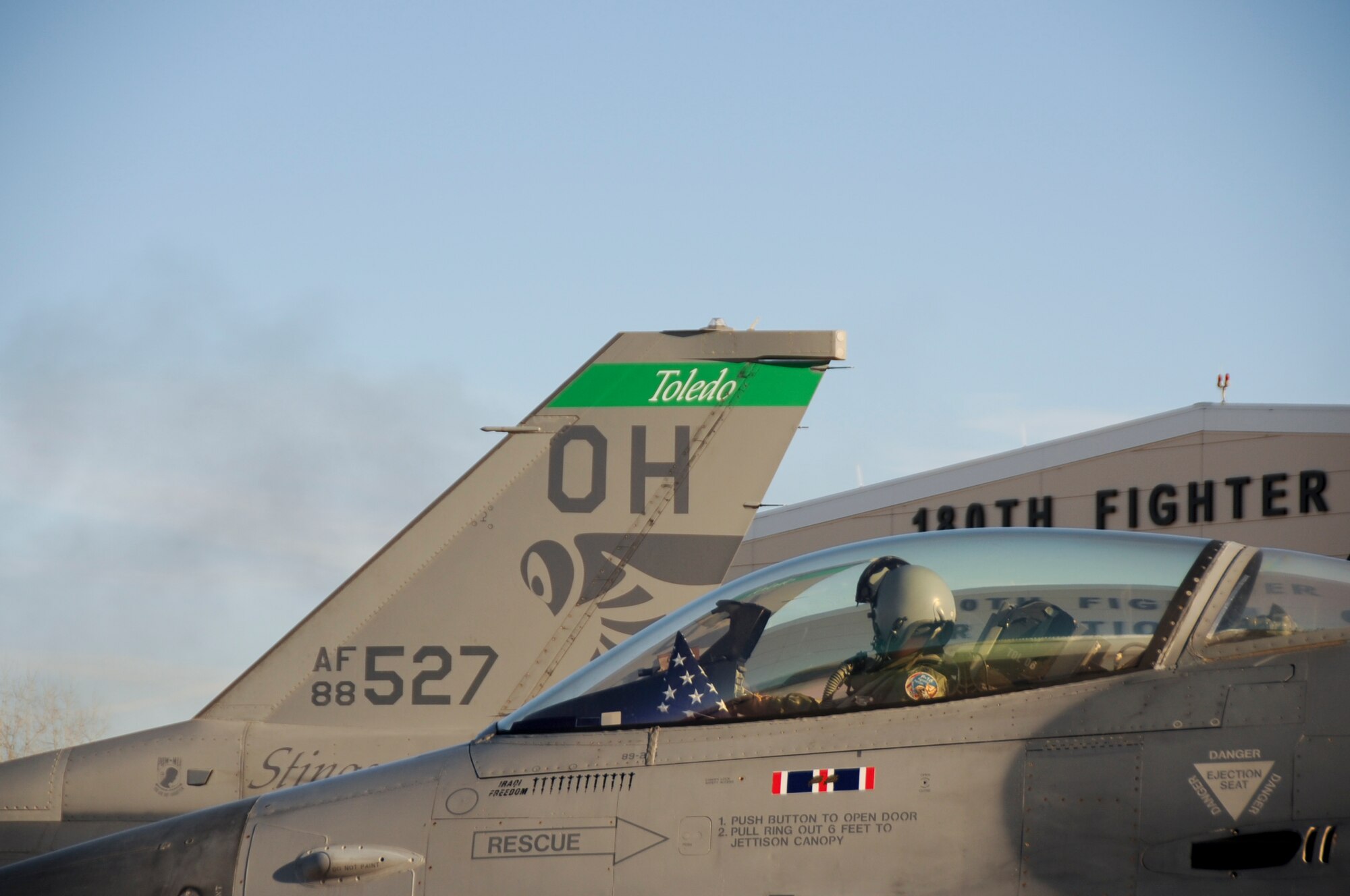 To mark the 20th anniversary of Lt. Mike Young’s passing, Lt. Col. Tim Moses, 180th FW Operations Support Squadron Commander, carried with him an American flag and a United States Air Force flag and flew up the coast of Lake Huron and over the crash site, where a memorial in Lt. Young’s name now stands.  The Air Force flag was presented to the Young family in honor of their sacrifice all of those years ago.180th Fighter Wing members, along with family and friends of pilot, Lt. Mike Young gathered for a small memorial honoring the pilot, 20 years after Young died when his A-7 Corsair crashed during a routine training mission. The group gathered at the 180th Fighter Wing, Ohio Air National Guard Base, Swanton, OH, Nov. 30.