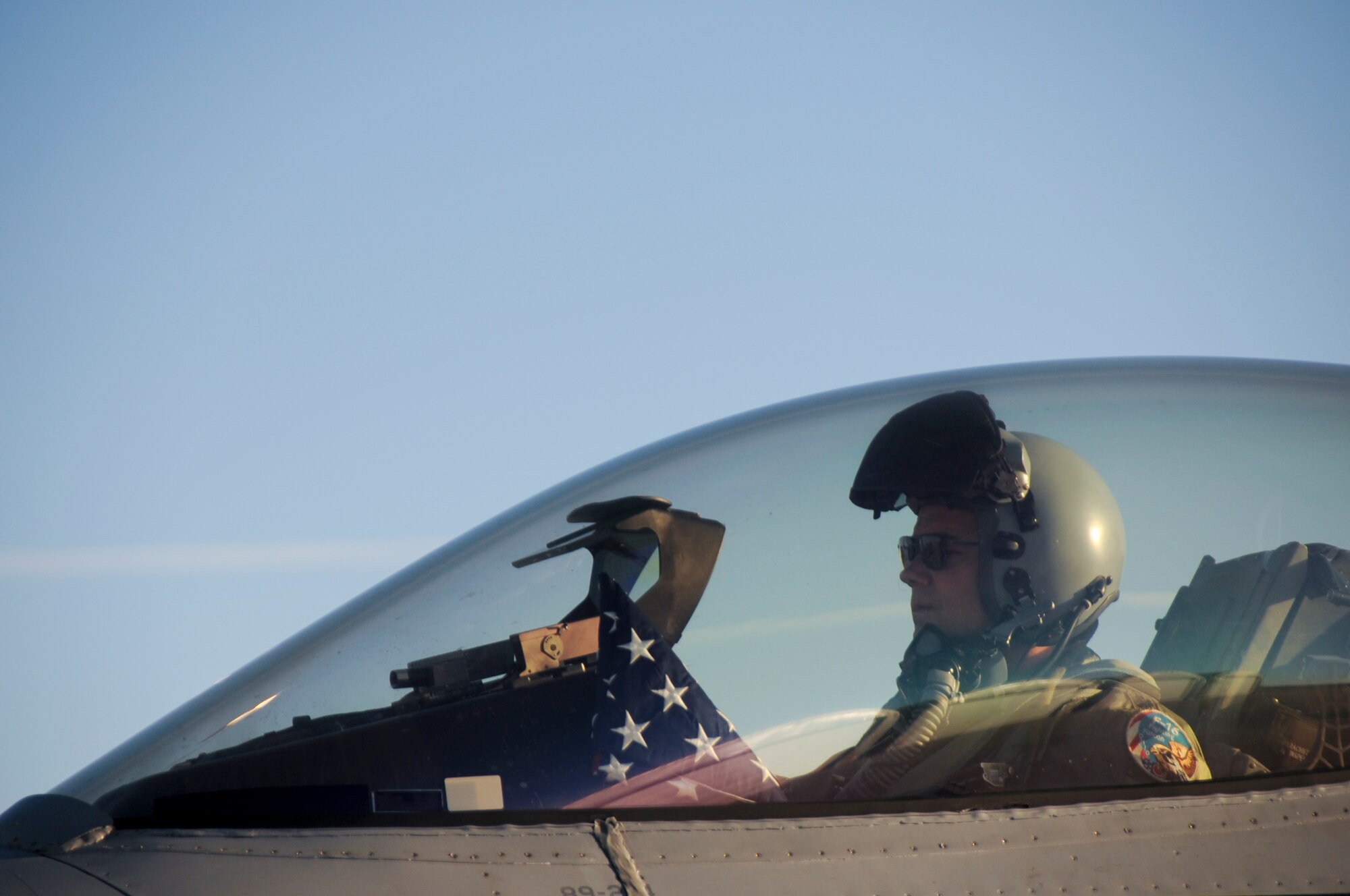 To mark the 20th anniversary of Lt. Mike Young’s passing, Lt. Col. Tim Moses, 180th FW Operations Support Squadron Commander, carried with him an American flag and a United States Air Force flag and flew up the coast of Lake Huron and over the crash site, where a memorial in Lt. Young’s name now stands.  The Air Force flag was presented to the Young family in honor of their sacrifice all of those years ago.180th Fighter Wing members, along with family and friends of pilot, Lt. Mike Young gathered for a small memorial honoring the pilot, 20 years after Young died when his A-7 Corsair crashed during a routine training mission. The group gathered at the 180th Fighter Wing, Ohio Air National Guard Base, Swanton, OH, Nov. 30.
