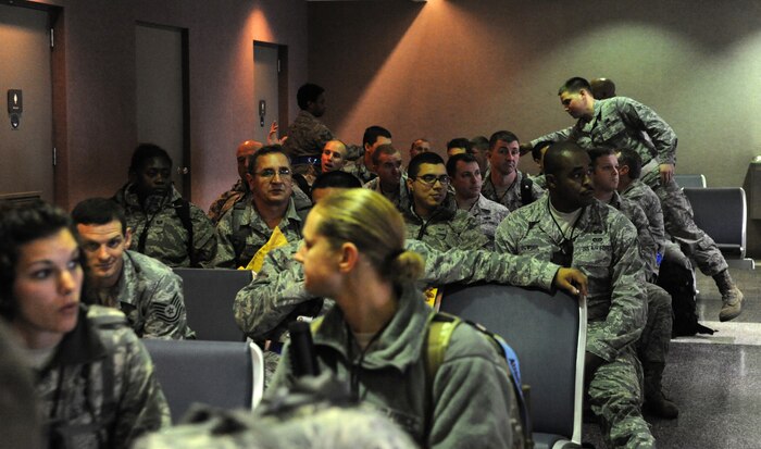 Airmen from Joint Base Charleston relax in the Passenger Terminal at Joint Base Charleston -Air Base after returning from the Operational Readiness Inspection Dec. 5. The ORI lasted from Nov. 29 through Dec. 6. (U.S. Air Force photo/Airmen 1st Class Ashlee Galloway)