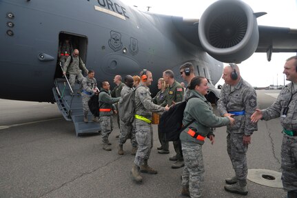 Joint Base Charleston leaders greet Airmen on their return from the Operational Readiness Inspection Dec. 5 at Joint Base Charleston - Air Base. The ORI lasted from Nov. 29 through Dec. 6. (U.S. Air Force photo/Airmen 1st Class Ashlee Galloway) 