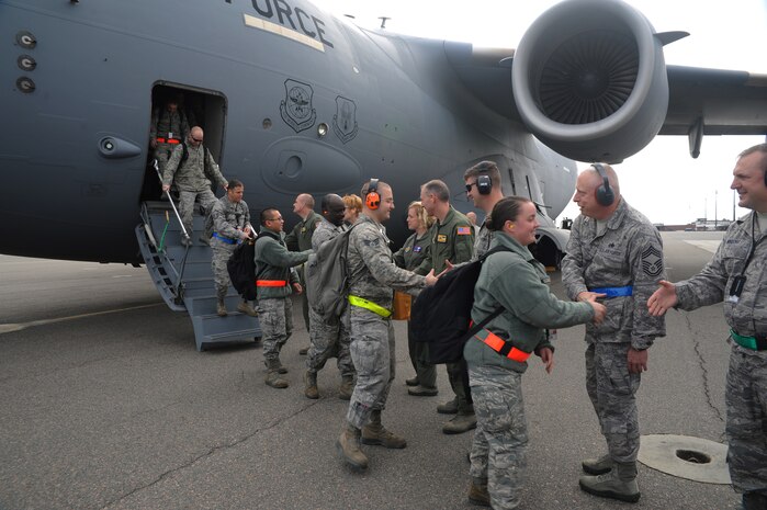 Joint Base Charleston leaders greet Airmen on their return from the Operational Readiness Inspection Dec. 5 at Joint Base Charleston - Air Base. The ORI lasted from Nov. 29 through Dec. 6. (U.S. Air Force photo/Airmen 1st Class Ashlee Galloway) 