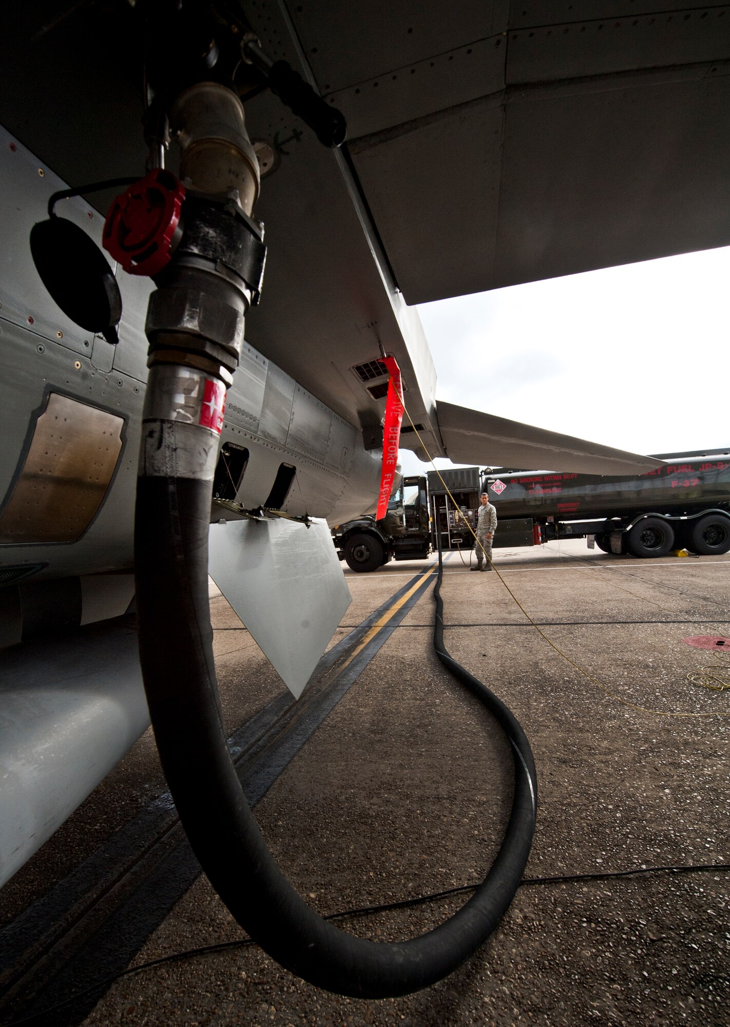 Airman Jonathan Quinchia, of the 96th Logistics Readiness Squadron, sends the fuel from his R-11 6,000 gallon tanker truck to the 46th Test Wing’s F-16 Fighting Falcon at Eglin Air Force Base, Fla.  Last year, more than 14 million gallons of fuel and cryogenics products were delivered by the Petroleum, Oil and Lubricants flight to fulfill the 8,000 test and training missions on base. (U.S. Air Force photo/Samuel King Jr.)
