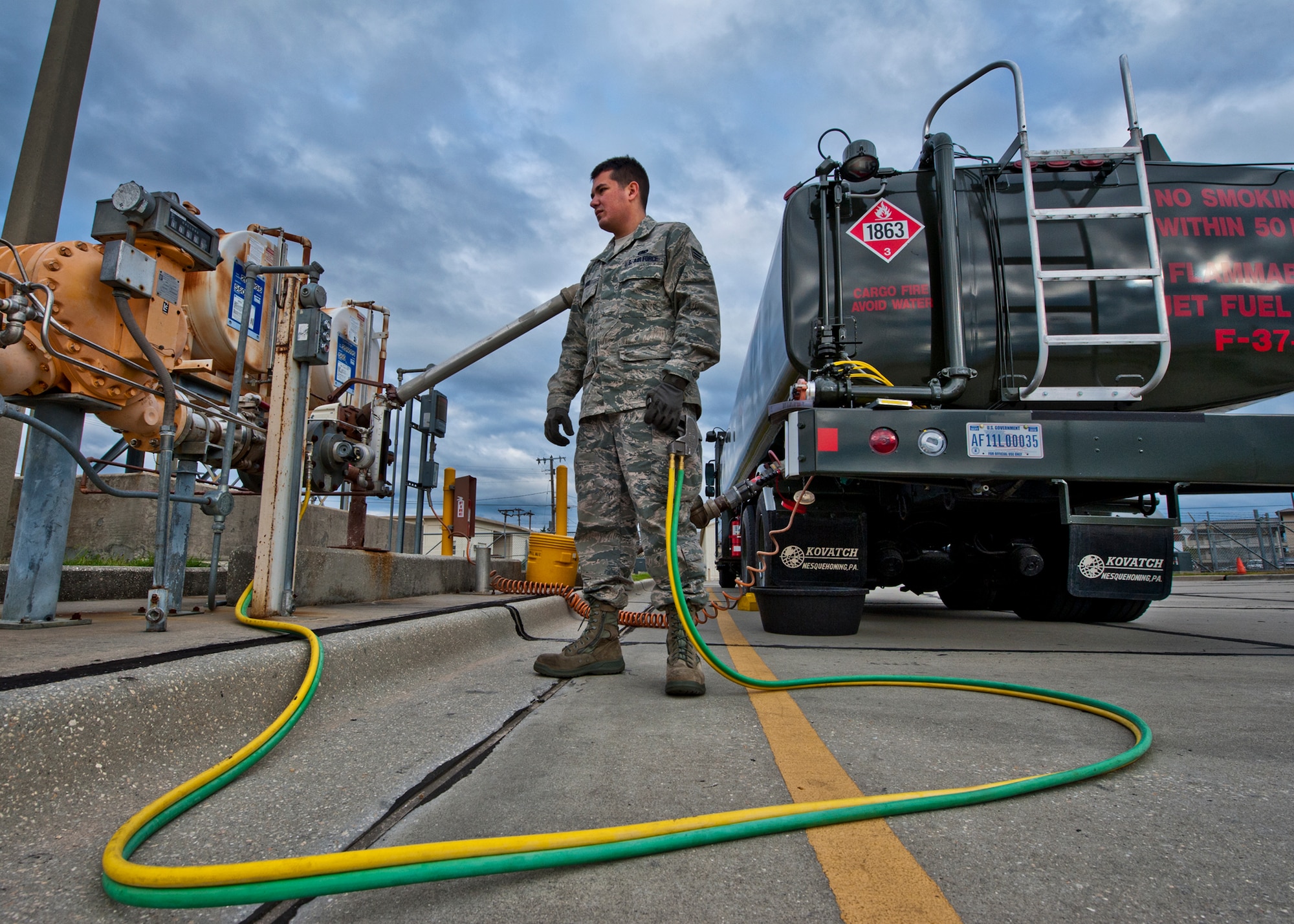 Senior Airman Jason Lord, of the 96th Logistics Readiness Squadron, watches the fuel gauge as JP-8 fills up his 6,000 gallon R-11 tanker truck.  The fuel flows from a large storage tank into the truck.  It will remain in the vehicle until it is delivered to the aircraft. Last year, more than 14 million gallons of fuel and cryogenics products were delivered by the flight to fulfill the 8,000 test and training missions on base. (U.S. Air Force photo/Samuel King Jr.)