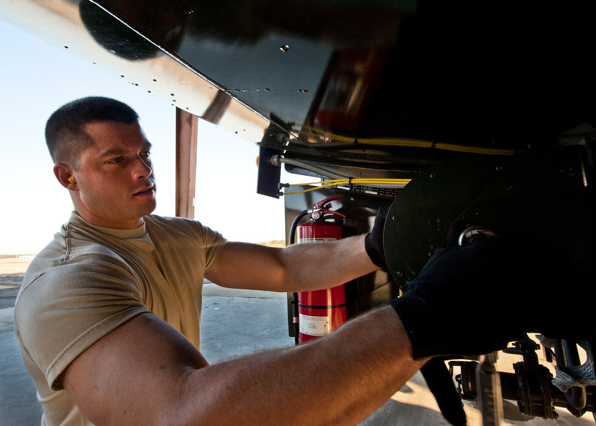 Staff Sgt. Daniel Blowers, of the 96th Logistics Readiness Squadron, tightens a loose bolt on an R-11 truck during its morning inspection at Eglin Air Force Base, Fla.  Each morning, Airmen from the petroleum, oil and lubricants flight inspect every fuel truck in the fleet to include checking the seals, lights, the hoses for tears or gashes and taking fuel samples from the bottom of each tank.  (U.S. Air Force photo/Samuel King Jr.)
