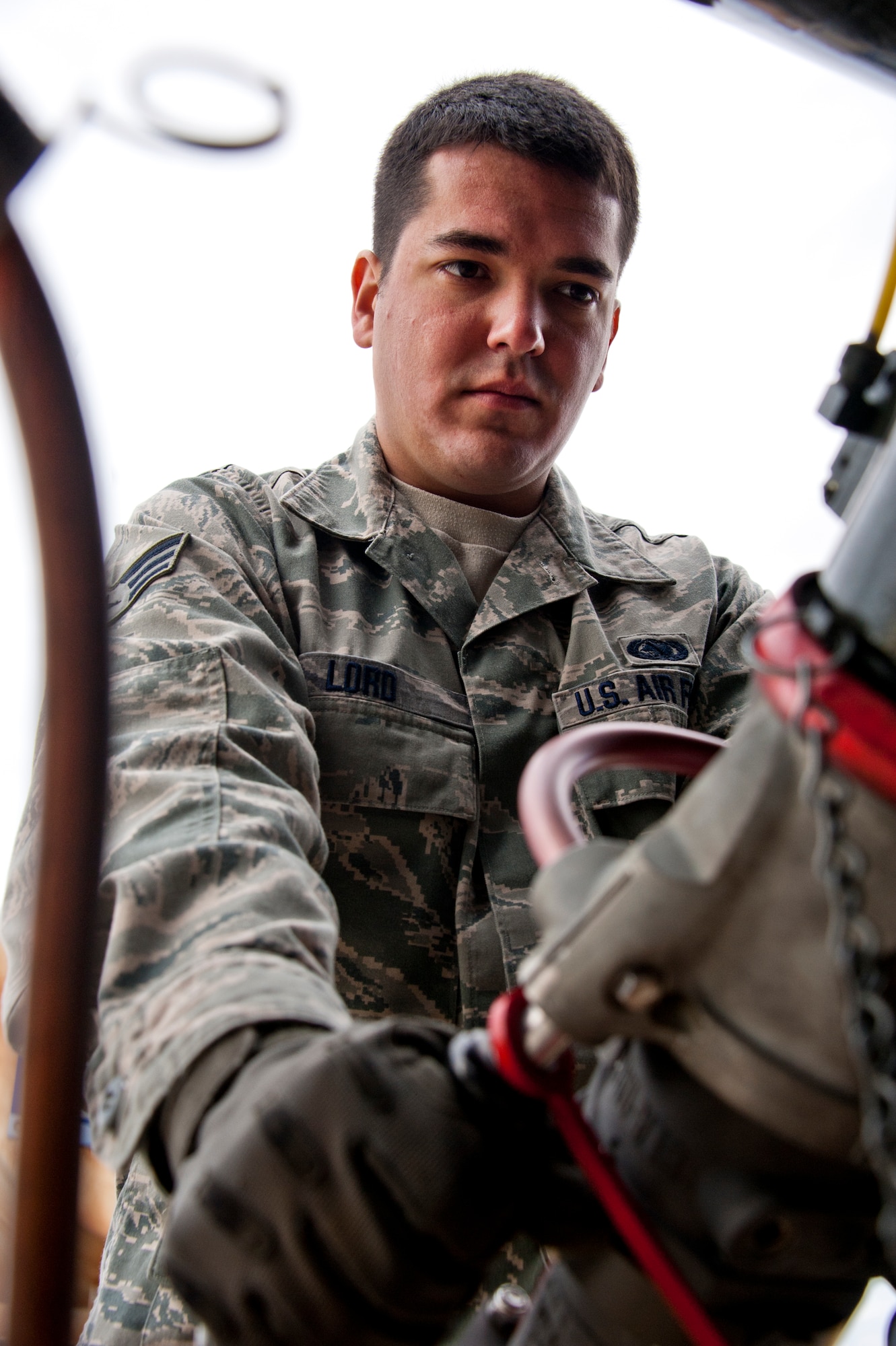 Senior Airman Jason Lord, of the 96th Logistics Readiness Squadron, connects the single-point nozzle to his R-11 tanker truck before refilling it with JP-8.  The fuel flows from a large storage tank into the truck.  It will remain in the vehicle until it is delivered to the aircraft. Last year, more than 14 million gallons of fuel and cryogenics products were delivered by the flight to fulfill the 8,000 test and training missions on base. (U.S. Air Force photo/Samuel King Jr.)