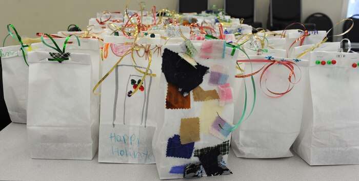 Bags of cookies, decorated by children from Joint Base Charleston Child Development Center and Youth Center, are ready to be deliverd to Airmen and Sailors living in the dorms and to those who are deployed, courtesy of the Team Charleston Spouses Club. (U.S. Air Force photo/Airmen 1st Class Ashlee Galloway)