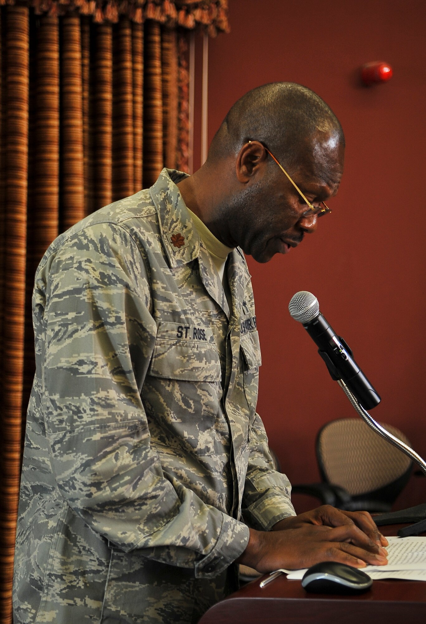 Chaplain (Maj.) Elwin St. Rose, 379th Air Expeditionary Wing chaplain, gives the invocation during a Pearl Harbor Remembrance Luncheon Dec. 7, 2011, at an undisclosed location in Southwest Asia. St. Rose, a native of Columbus, Ohio, is deployed from Wright-Patterson AFB, Ohio. (U.S. Air Force photo/Senior Airman Paul Labbe)