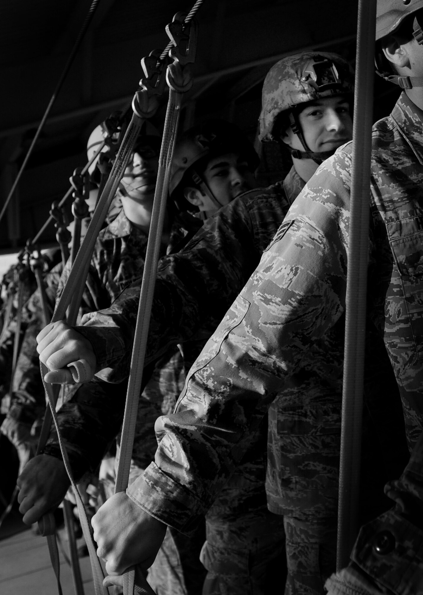 Airmen with the 8th Air Support Operations Squadron wait in line during a sustained training Dec. 6 at Aviano Air Base, Italy.  The purpose of training is to review procedure points that should be followed while performing jumps. (U.S. Air Force photo/Staff Sgt. Evelyn Chavez)