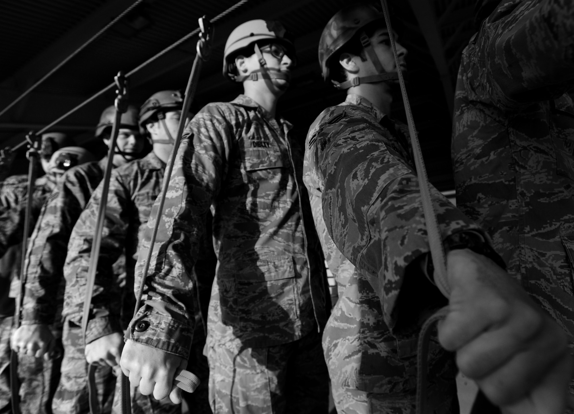 Airmen with the 8th Air Support Operations Squadron wait in line during a sustained training Dec. 6 at Aviano Air Base, Italy.  The Airmen participated in sustained training with the 173rd Airborne Brigade Combat Team in order to remember points of performance during jumps. (U.S. Air Force photo/Staff Sgt. Evelyn Chavez)