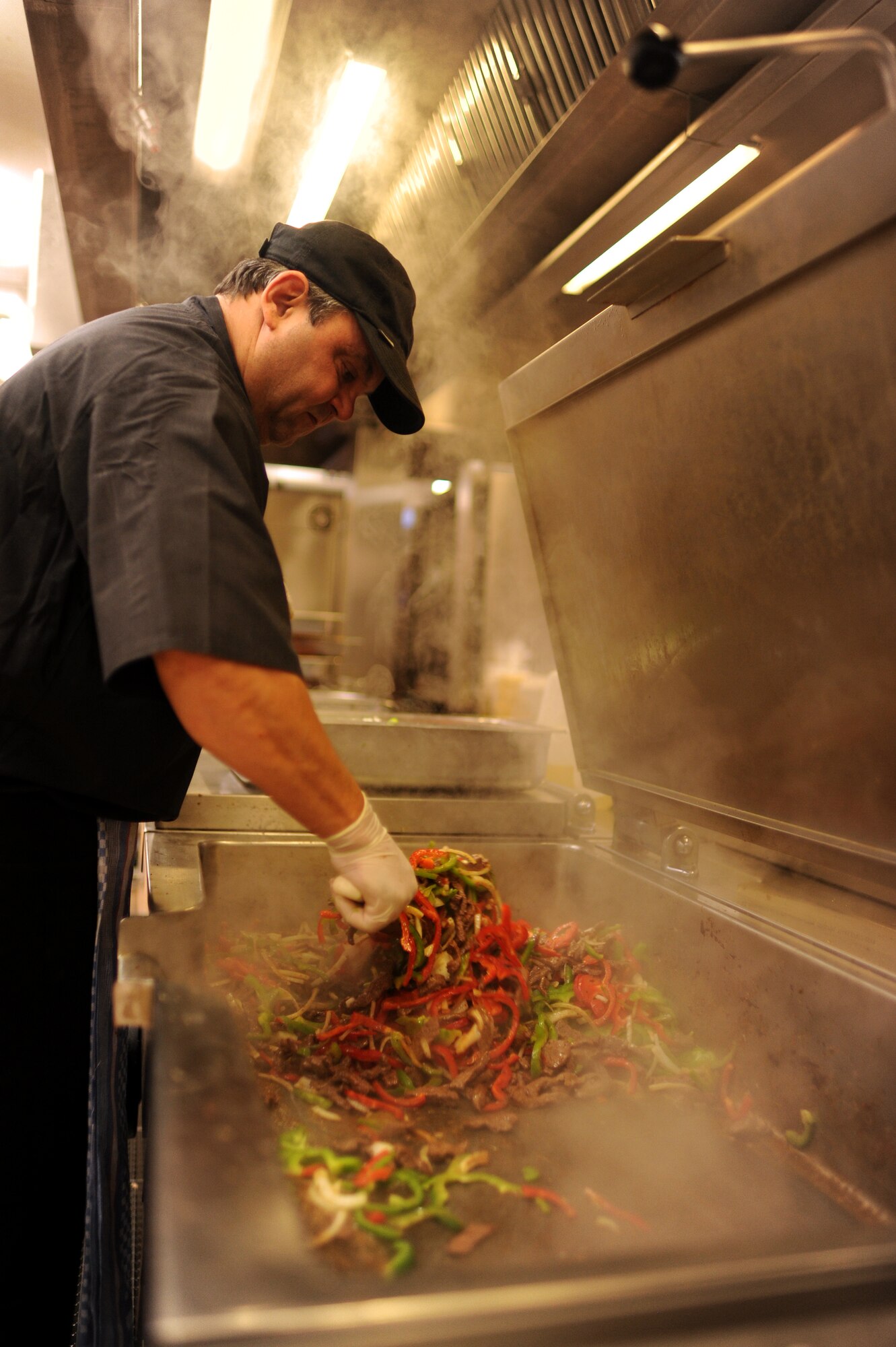 SPANGDAHLEM AIR BASE, Germany – Heinz Toeller, 52nd Force Support Squadron cook, prepares lunch at Club Eifel here Dec. 1. Club Eifel Catering offers buffets and hors d’oeuvres style meals for pick-up or delivery and a catering staff upon request. For more information, call DSN 452-4642 or 06565-61-4642. (U.S. Air Force photo/Airman 1st Class Matthew B. Fredericks)