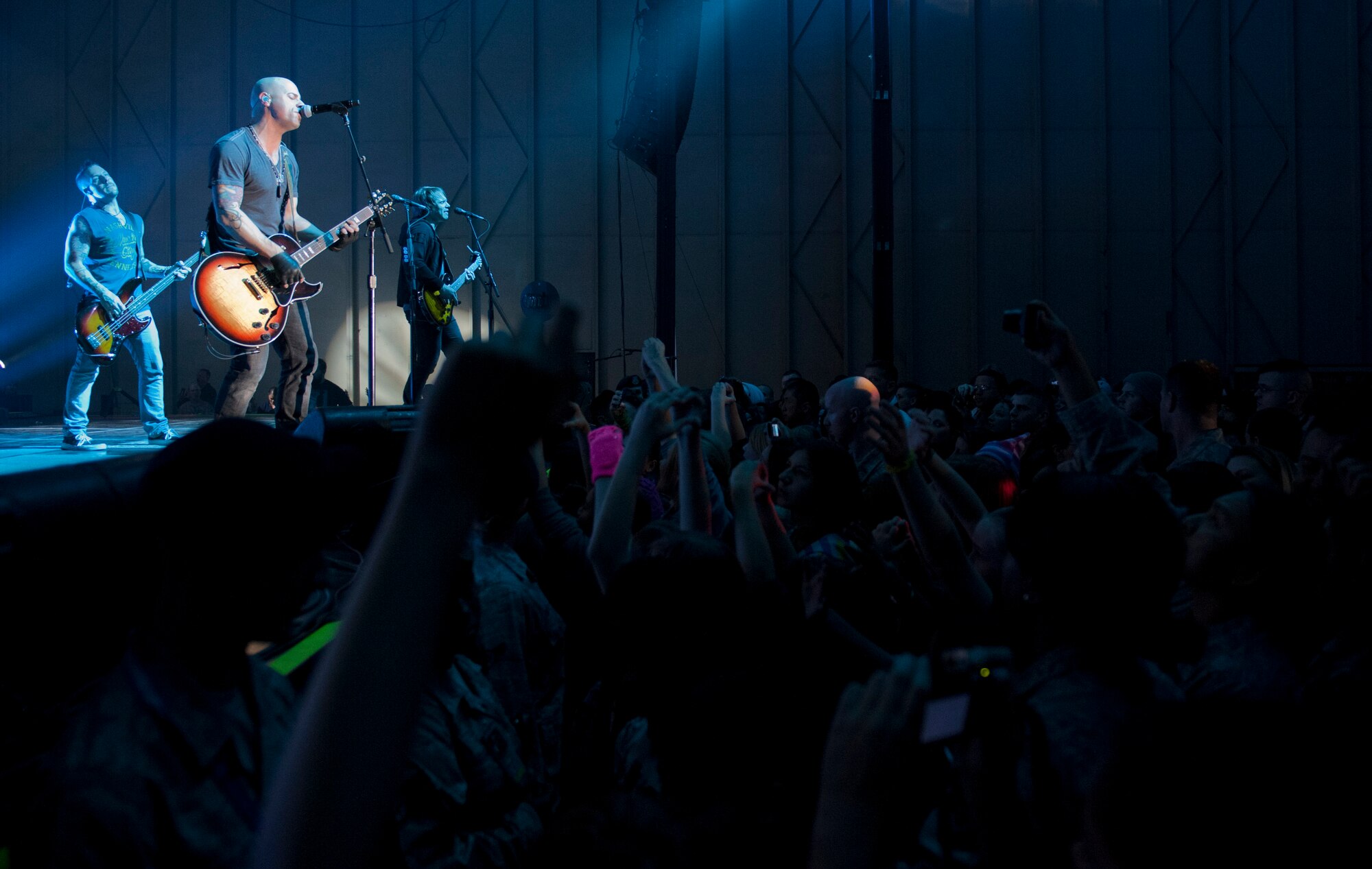 Members of the band Daughtry play for Airmen and their families during an Operation Seasons Greetings Tour for Troops Dec. 6, 2011, at Incirlik Air Base, Turkey. The OSG is a 13-day, six-concert tour through Southwest Asia and Europe. (U.S. Air Force photo by Senior Airman Anthony Sanchelli/Released)