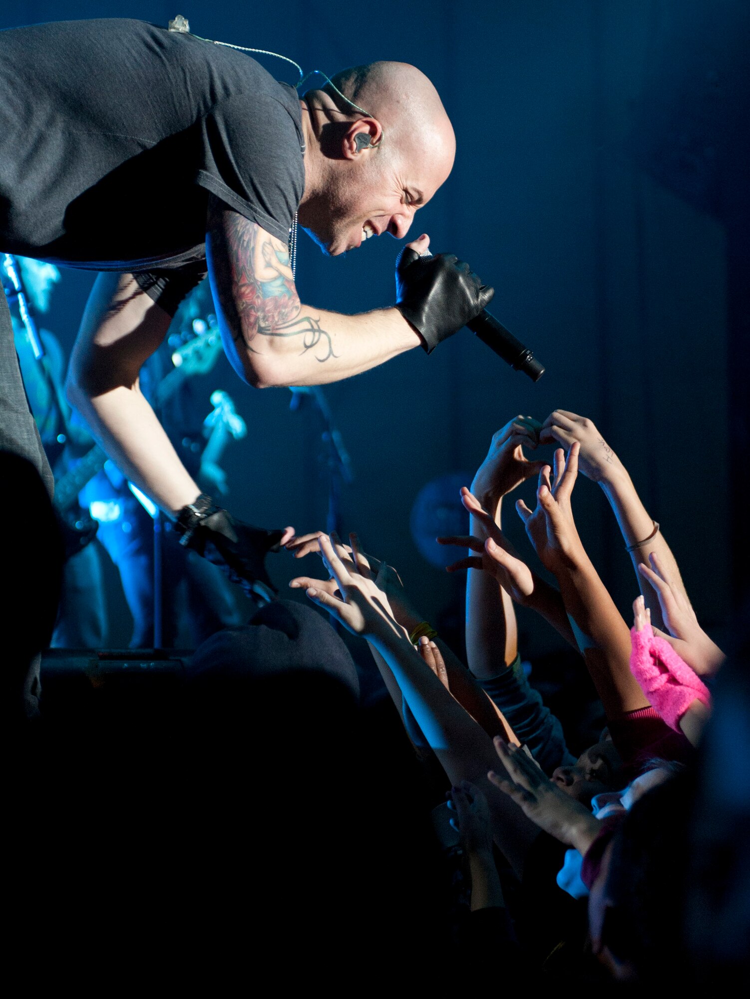 Chris Daughtry, lead singer for the band Daughtry, sings for Airmen and their families during an Operation Seasons Greetings Tour for Troops Dec. 6, 2011, at Incirlik Air Base, Turkey. The OSG is a 13-day, six-concert tour through Southwest Asia and Europe. (U.S. Air Force photo by Senior Airman Anthony Sanchelli/Released)