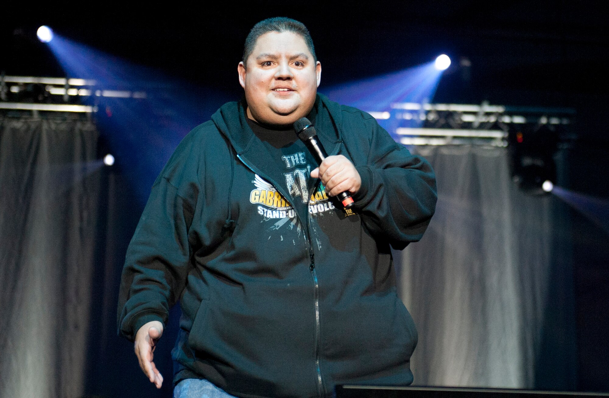 Comedian Gabriel "Fluffy" Iglesias entertains Airmen and their families during an Operation Seasons Greetings Tour for Troops Dec. 6, 2011, at Incirlik Air Base, Turkey. The OSG is a 13-day, six-concert tour through Southwest Asia and Europe. (U.S. Air Force photo by Senior Airman Anthony Sanchelli/Released)