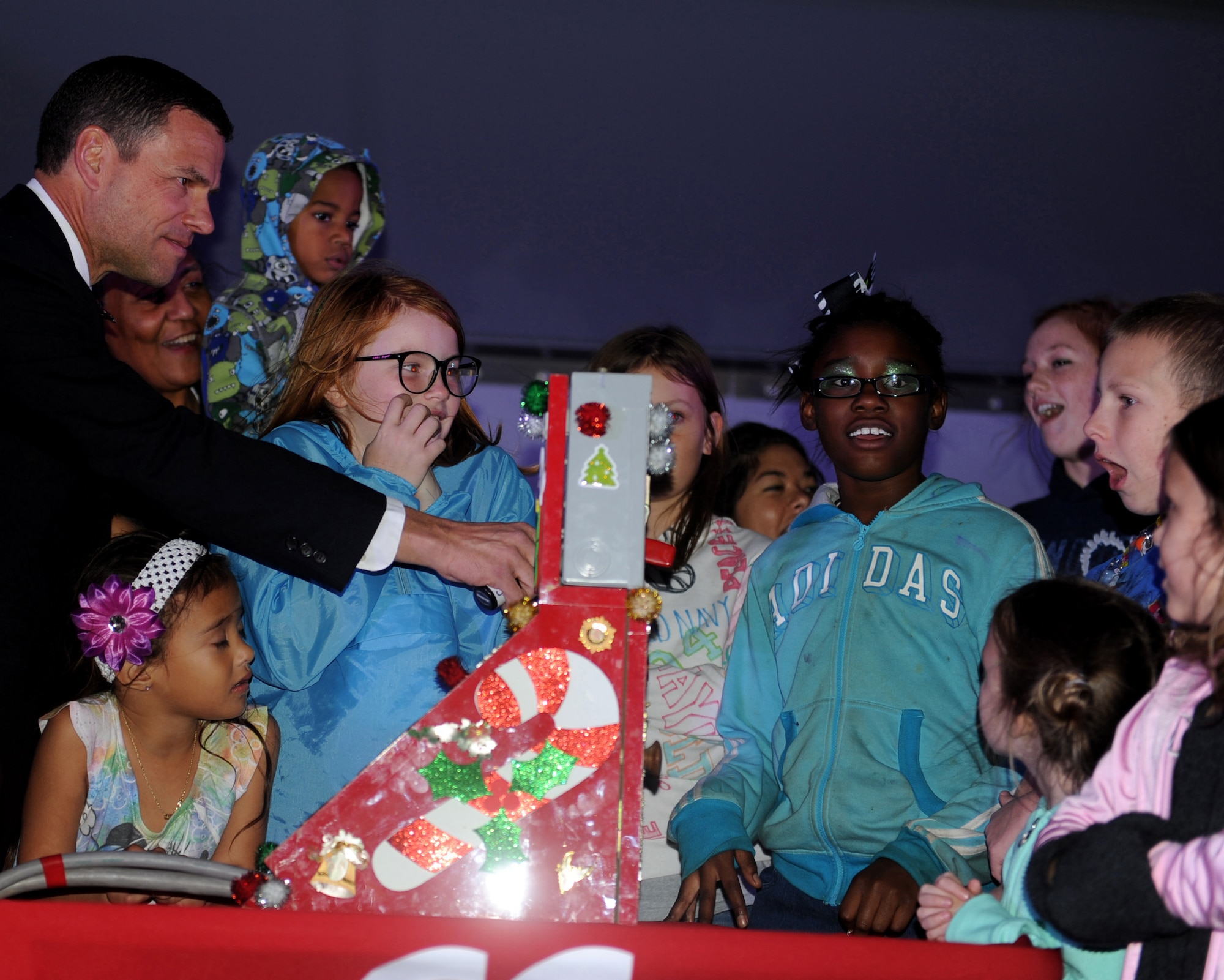 U.S. Air Force Brig. Gen. Matt Molloy prepares to light the annual Christmas tree at the Schilling Community Center during the 2011 Tinsel Town on Kadena Air Base, Japan, Dec. 2, 2011. Tinsel Town included many attractions for children including bouncers, a merry-go-round, train rides, and a chance for kids to meet Santa Claus. (U.S. Air Force photo by Airman 1st Class Justin Veazie/Released)