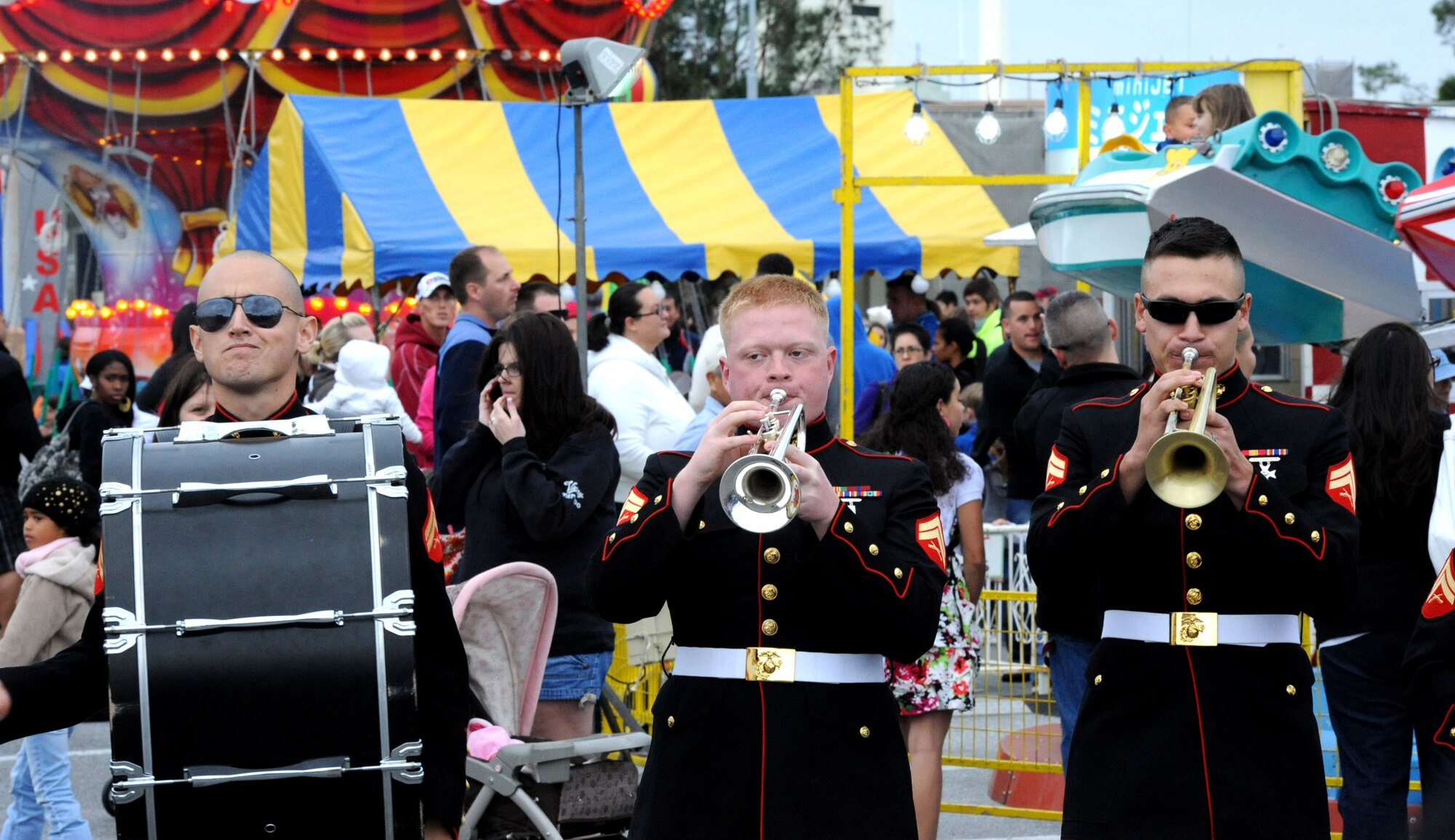 III Marine Expeditionary Force band performs at the 2011 Tinsel Town at the Schilling Community Center on Kadena Air Base, Japan, Dec. 2, 2011. Tinsel Town included many attractions for children including bouncers, a merry-go-round, train rides, and a chance for kids to meet Santa Claus. (U.S. Air Force photo by Airman 1st Class Justin Veazie/Released)