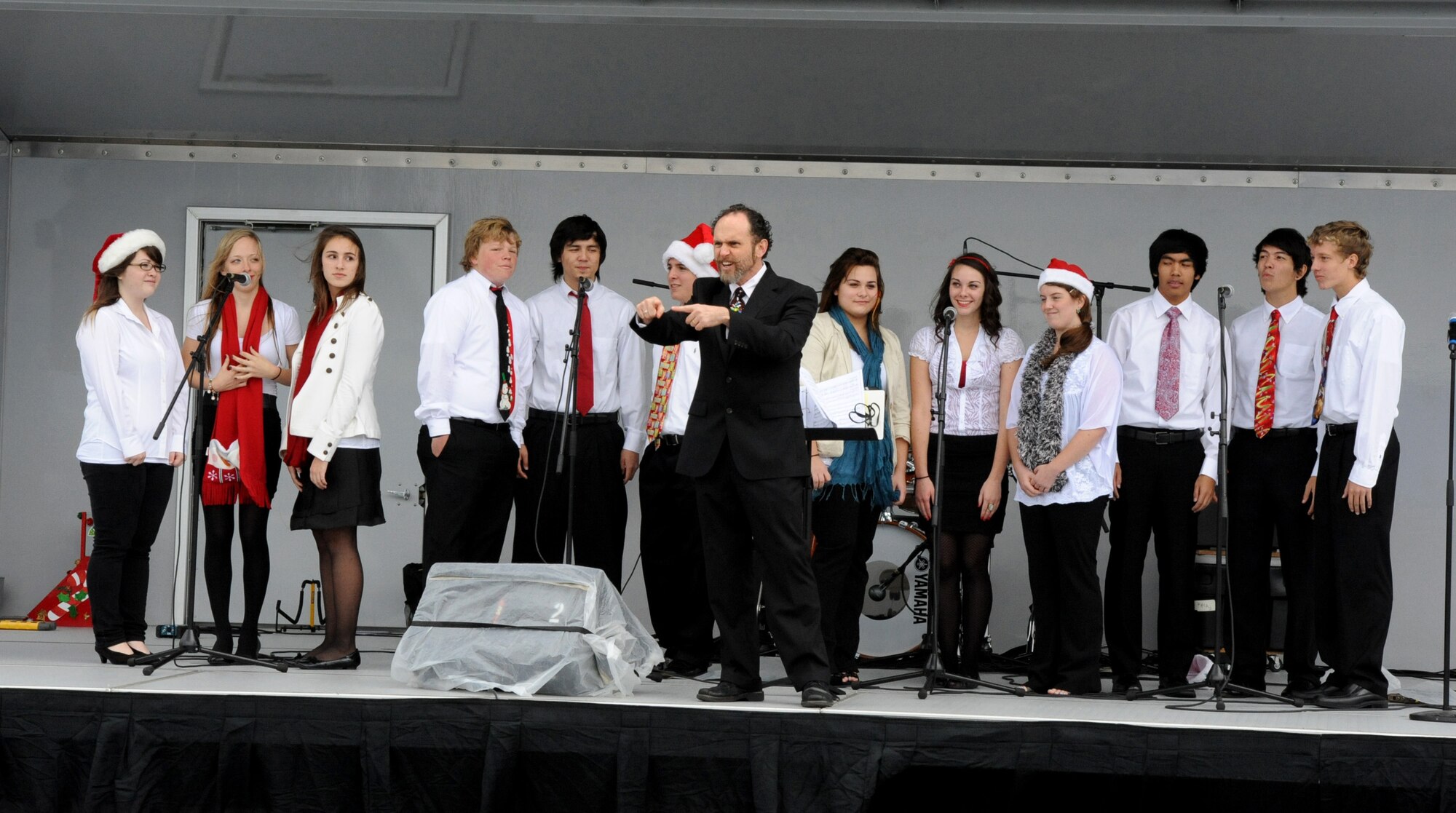 The Kadena High School Choir performs at the Schilling Community Center during the 2011 Tinsel Town on Kadena Air Base, Japan Dec. 2, 2011. Tinsel Town included many attractions for children including bouncers, a merry-go-round, train rides, and a chance for kids to meet Santa Claus. (U.S. Air Force photo by Airman 1st Class Justin Veazie/Released)