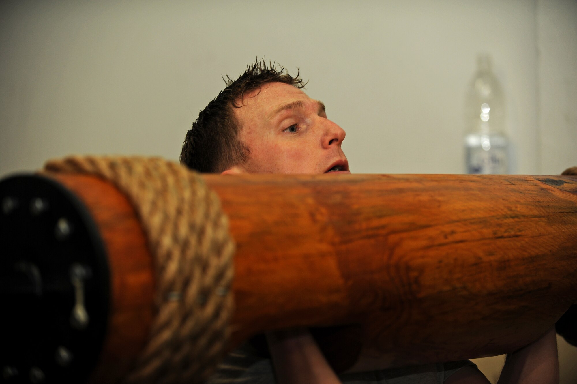 SPANGDAHLEM AIR BASE, Germany – Staff Sgt. Eric Sims, 52nd Component Maintenance Squadron aircraft fuels systems repair craftsman, lifts a weighted log during fitness training at the combat fitness facility here Nov. 30. Air Force Fitness Assessments continue throughout the winter season; however, the 1.5 mile run portion will consist of 22 laps inside the Skelton Memorial Fitness Center gymnasium on days when the temperature falls below 20 degrees Fahrenheit. (U.S. Air Force photo/Airman 1st Class Matthew B. Fredericks)