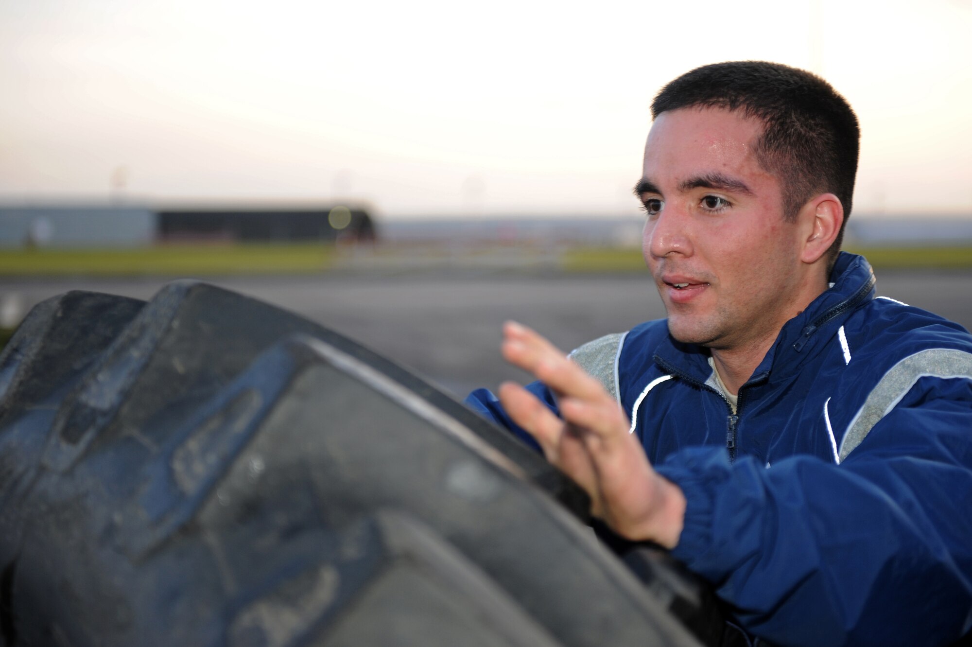 SPANGDAHLEM AIR BASE, Germany – Staff Sgt. Joshua Estrada, 52nd Component Maintenance Squadron electrical and environmental systems journeyman, lifts a tire during fitness training at the combat fitness facility here Nov. 30. Air Force Fitness Assessments continue throughout the winter season; however, the 1.5 mile run portion will consist of 22 laps inside the Skelton Memorial Fitness Center gymnasium on days when the temperature falls below 20 degrees Fahrenheit. (U.S. Air Force photo/Airman 1st Class Matthew B. Fredericks)