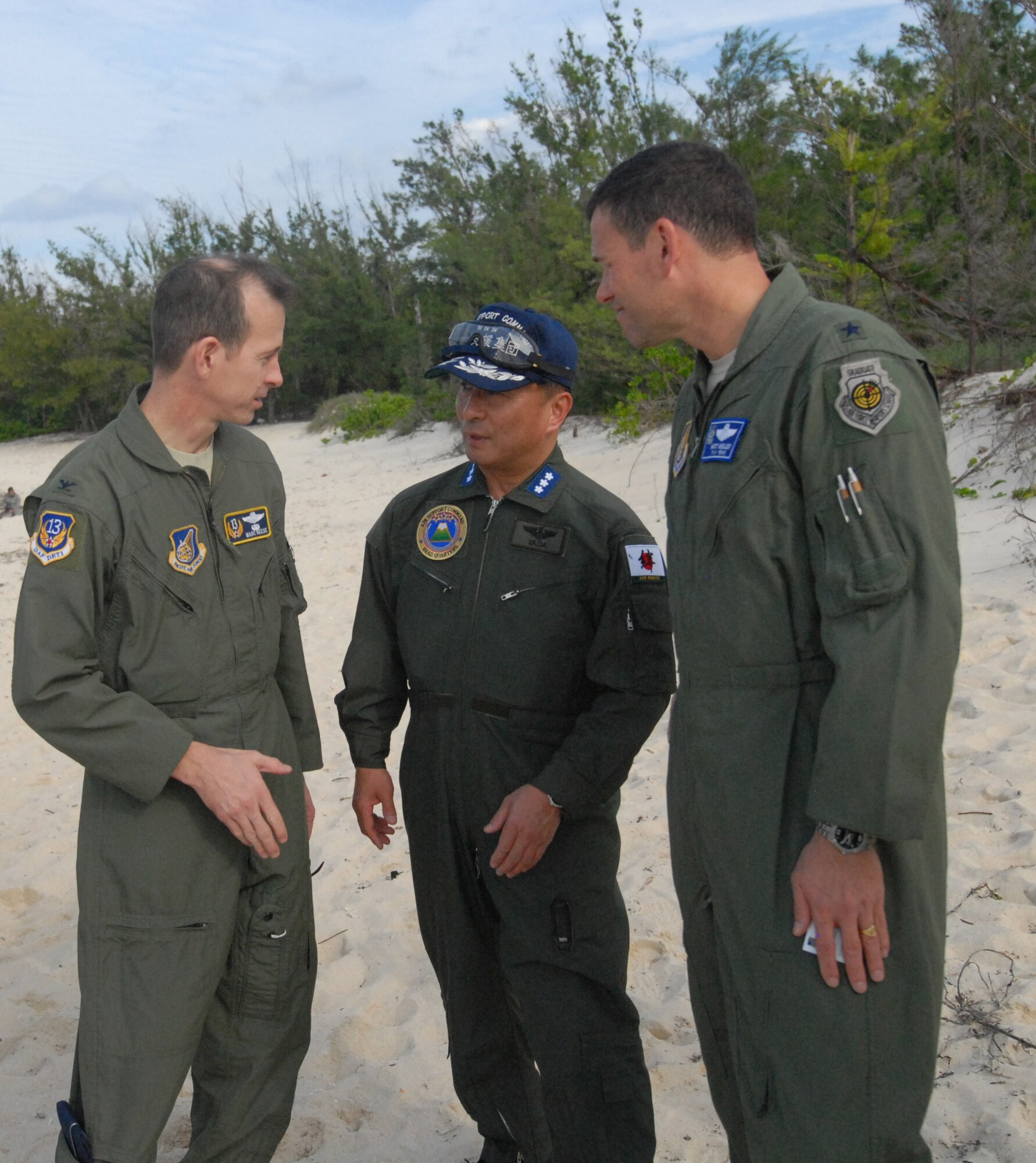 U.S. Air Force Col. Marc Reese, 13th Air Force Det 1 commander, Brig. Gen. Matthew Molloy, 18th Wing commander, and Lt. Gen Kiyoshi Yada, Japanese Air Self Defense Force Air Support Command commander, discuss their observations during the Cope Angel exercise in Okinawa, Japan, Dec. 5, 2011.This bilateral exercise is used to increase combat readiness, highlight interoperability with Japanese counterparts and to conduct effective planning and execution. (U.S. Air Force photo by Tech. Sgt. Lakisha A. Croley/Released) 