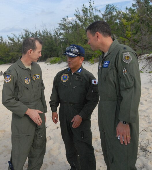 U.S. Air Force Col. Marc Reese, 13th Air Force Det 1 commander, Brig. Gen. Matthew Molloy, 18th Wing commander, and Lt. Gen Kiyoshi Yada, Japanese Air Self Defense Force Air Support Command commander, discuss their observations during the Cope Angel exercise in Okinawa, Japan, Dec. 5, 2011.This bilateral exercise is used to increase combat readiness, highlight interoperability with Japanese counterparts and to conduct effective planning and execution. (U.S. Air Force photo by Tech. Sgt. Lakisha A. Croley/Released) 