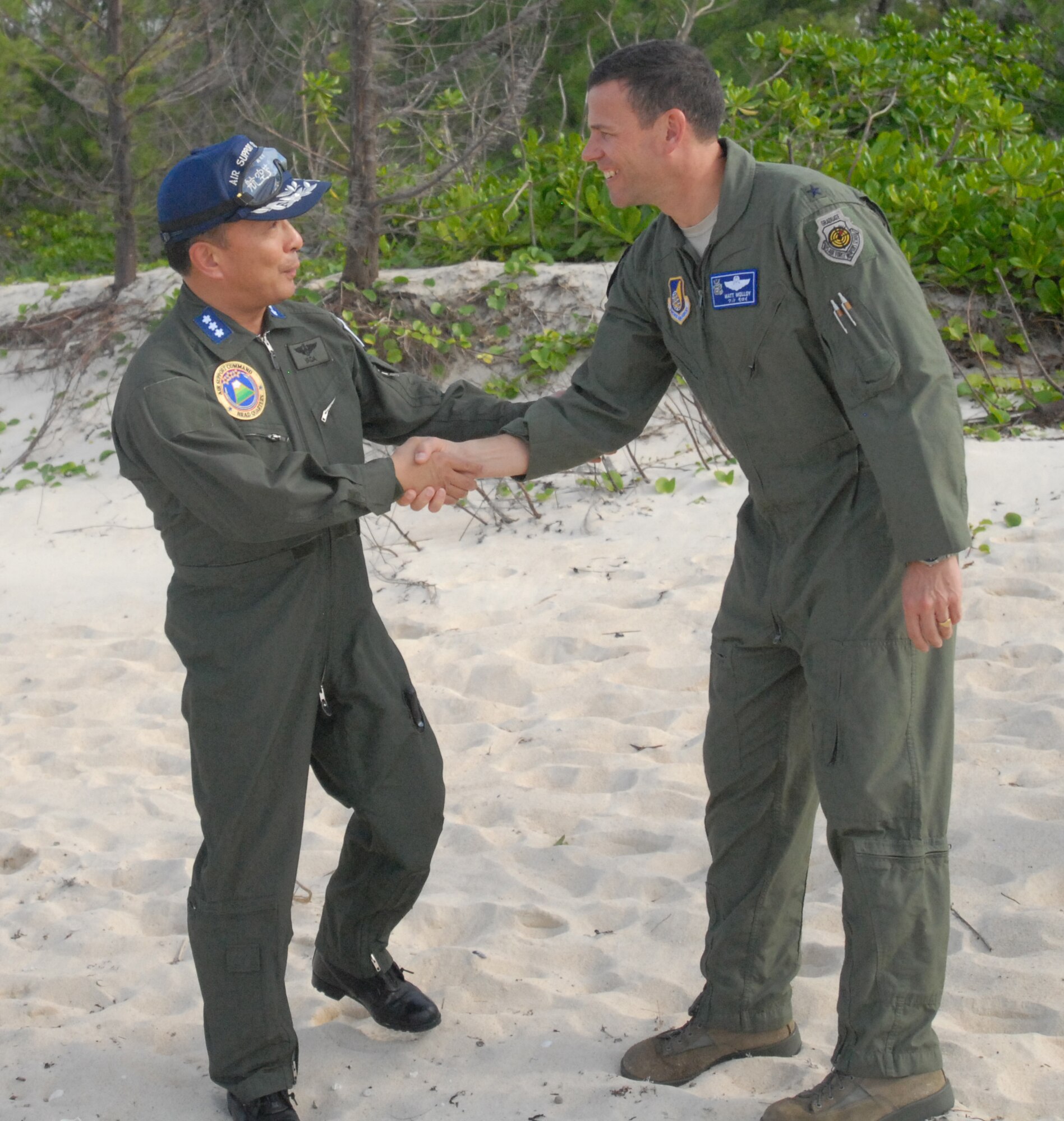 U.S. Air Force Brig. Gen. Matthew Molloy, 18th Wing commander, greets Lt. Gen Kiyoshi Yada, Japanese Air Self Defense Force Air Support Command commander, during the Cope Angel exercise in Okinawa Japan, Dec. 5, 2011.This bilateral exercise is used to increase combat readiness, highlight interoperability with Japanese counterparts and to conduct effective planning and execution. (U.S. Air Force photo by Tech.Sgt. Lakisha A. Croley/Released) 