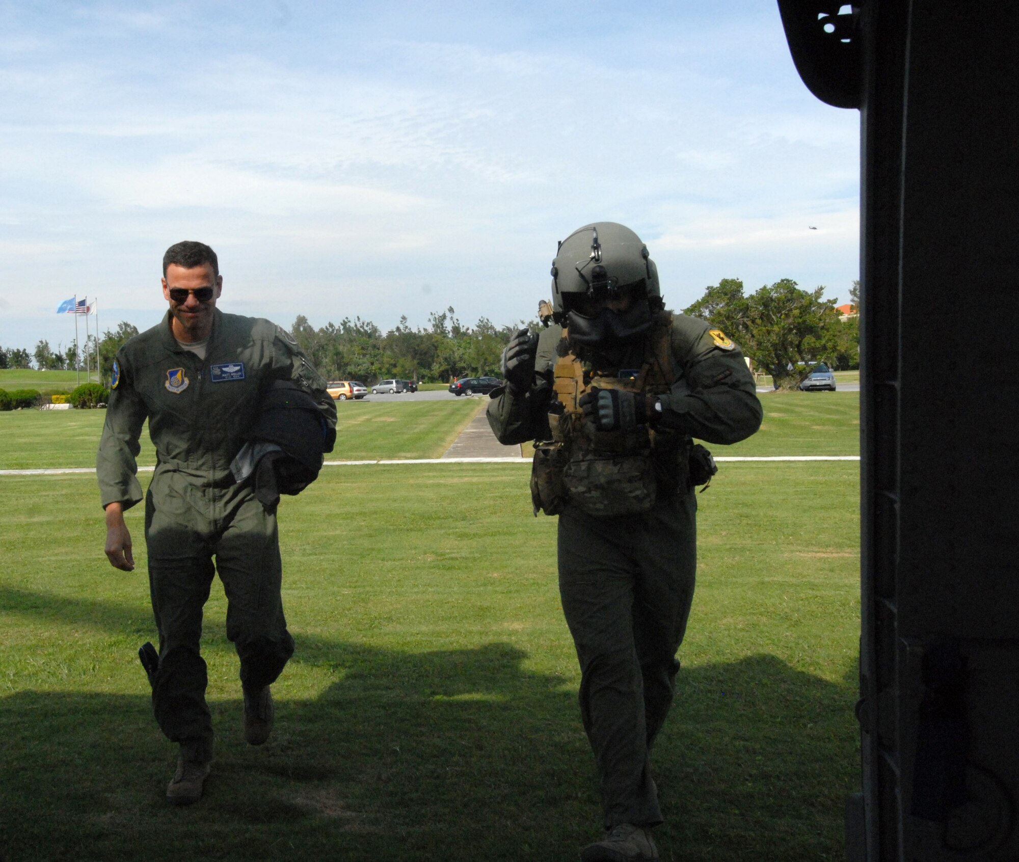 U.S. Air Force Brig. Gen. Matthew Molloy, 18th Wing commander, is walked to a U.S. Air Force HH-60 Pave Hawk by U.S. Air Force Staff Sgt. Will Gonzalez, 33rd Rescue Squadron gunner, on Kadena Air Base, Japan, Dec. 5, 2011, during the Cope Angel exercise. This bilateral exercise is used to increase combat readiness and highlight interoperability with Japanese counterparts. (U.S. Air Force photo by Tech. Sgt. Lakisha A. Croley/Released) 