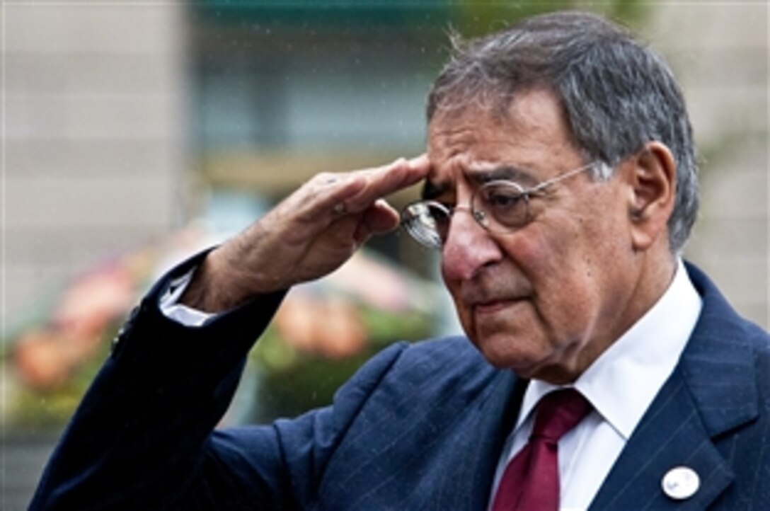 Defense Secretary Leon E. Panetta salutes during a wreath-laying ceremony at the Navy Memorial in Washington, D.C., Dec. 7, 2011, to mark the 70th anniversary of the attack on Pearl Harbor. Panetta also spoke with survivors and witnesses.