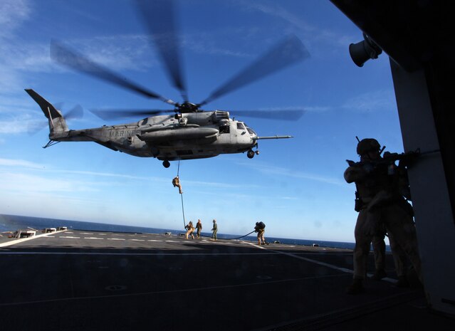 Marines and Sailors with the 24th Marine Expeditionary Unit's Force Reconnaissance Platoon and Security Element, Headquarters and Service Company, Battalion Landing Team 1st Battalion, 2nd Marine Regiment fast rope from a CH-53E Super Stallion while conducting a simulated Expanded, Visit, Board, Search and Seizure aboard the USNS Arctic, Dec. 7, 2011 The 24th MEU is currently taking part in Composite Training Unit Exercise (COMPTUEX), scheduled to take place Nov. 28 to Dec. 21. The training is meant to develop cohesion between the 24th MEU and Amphibious Squadron 8 (PHIBRON-8) in conducting amphibious operations, crisis response, and limited contingency operations while operating from the sea. The CH-53E helicopters are a detachment from HMH-464 based at Marine Corps Air Station New River, N.C., and comprise part of Marine Medium Tiltrotor Squadron VMM-261 (Rein), which is the Aviation Combat Element for the 24th MEU. (Official USMC Photo by: Lance Cpl. Michael Petersheim/ Released)
