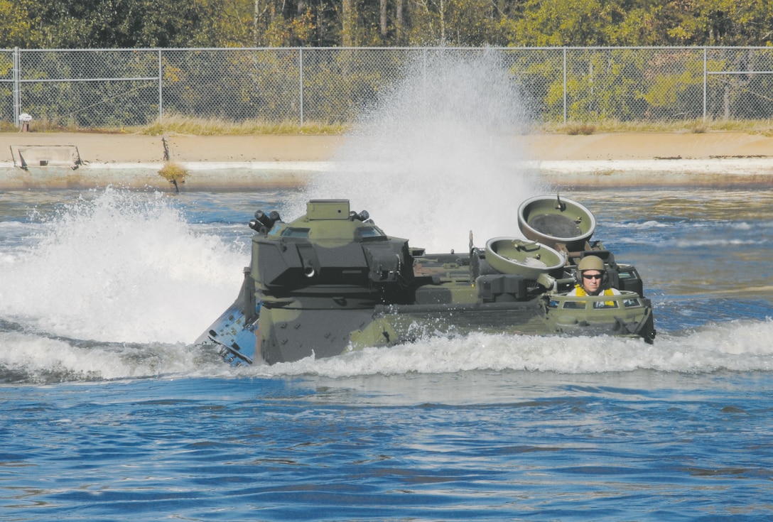 An amphibious assault vehicle proves its seaworthiness during testing at Maintenance Center Albany’s Test Pool, Dec. 1. Robert ‘Cujo’ Terry, heavy mobile equipment supervisor, Cost Work Center 723B, Maintenance Center Albany, demonstrates its ability to conduct amphibious operations by taking the AAV for a ‘swim.’