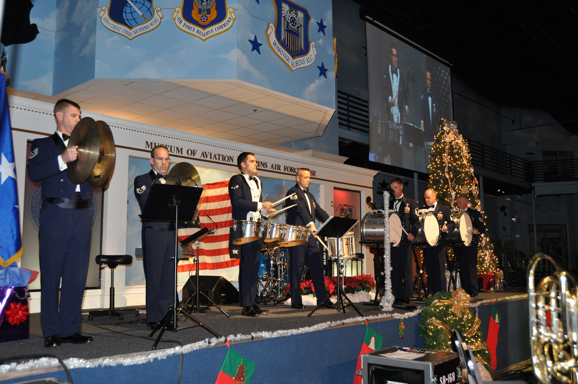 The Band of the U.S. Air Force Reserve performed to a standing room only crowd during the annual Holiday Concert at the Museum of Aviation Dec. 8.  The hour-long show featured traditional holiday songs, as well as special renditions of Christmas favorites like "Little Drummer Boy" being performed by the percussion section. (U.S. Air Force photo/Philip Rhodes)