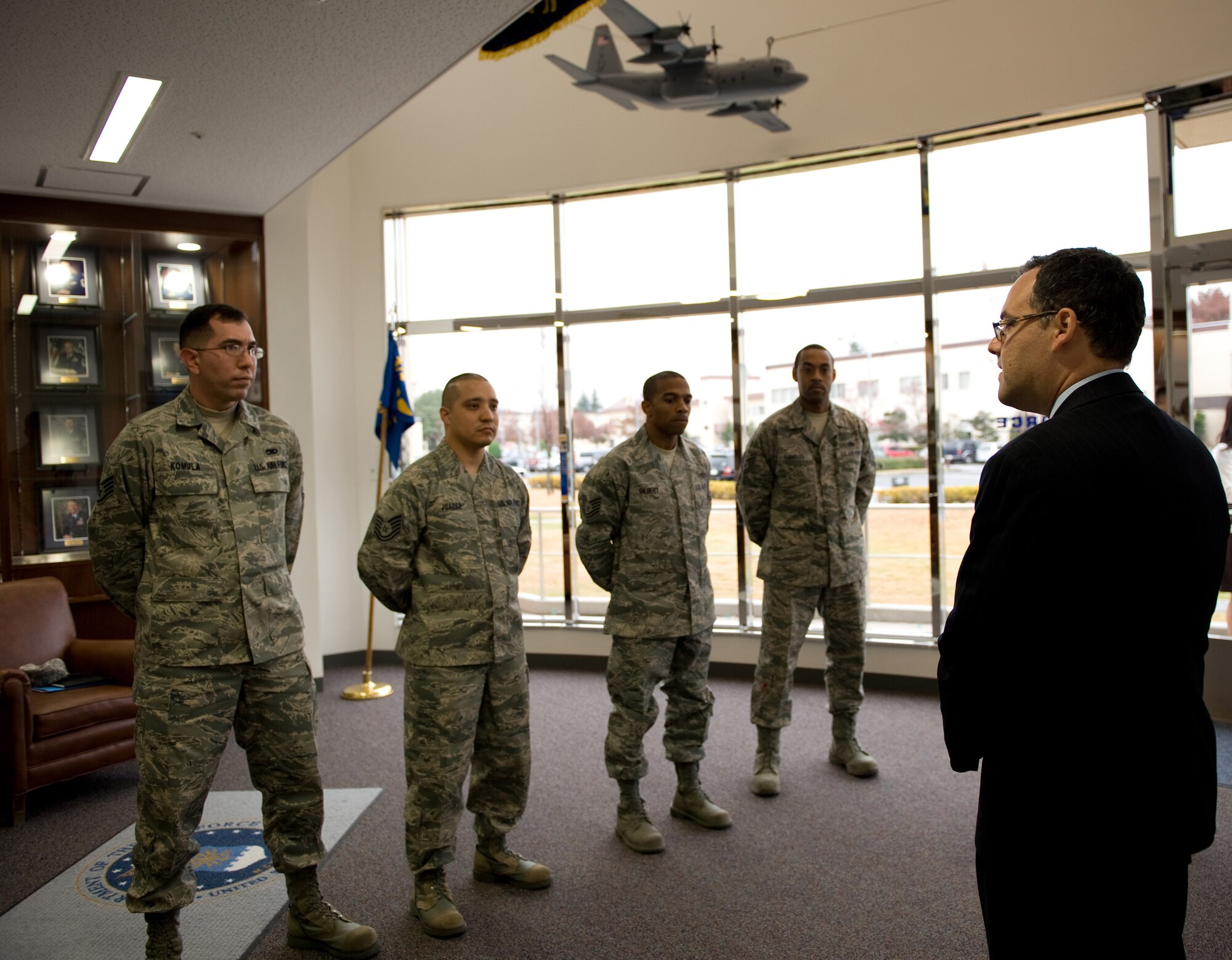 YOKOTA AIR BASE, Japan -- Daniel Ginsberg, Assistant Secretary of the Air Force for Manpower and Reserve Affairs, speaks with instructors from both the Airman Leadership School and First Term Airman Center while visiting the Professinoal Development Center at Yokota Air Base, Japan, Dec. 1, 2011. Ginsberg toured facilities throughout Yokota seeing the different programs throughout the 374th Airlift Wing Services provide in support of Airmen and their families currently stationed at Yokota. (U.S. Air Force Photo/Airman 1st Class Krystal M. Garrett)