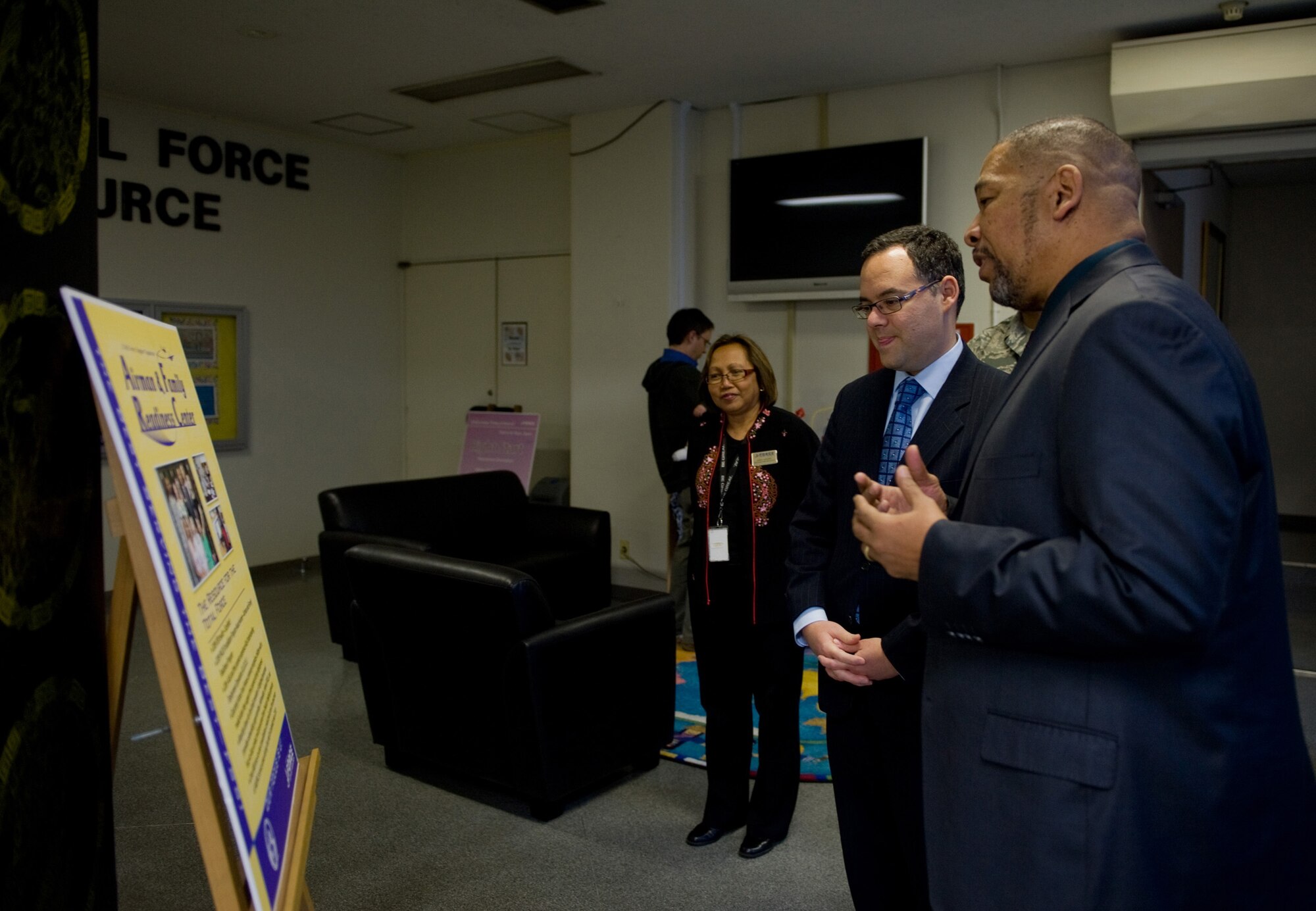 YOKOTA AIR BASE, Japan -- (Right) Steven Mayfield, chief of the Airman and Family Readiness Center, provides Daniel Ginsberg, Assistant Secretary of the Air Force for Manpower and Reserve Affairs a brief overview of the different programs agencies provide at Yokota Air Base, Japan, Dec. 1, 2011. As the Assistant Secretary of the Air Force for Manpower and Reserve Affairs, Ginsberg is responsible for overseeing the care and support of Airmen and their families worldwide. (U.S. Air Force photo/Airman 1st Class Krystal M. Garrett)