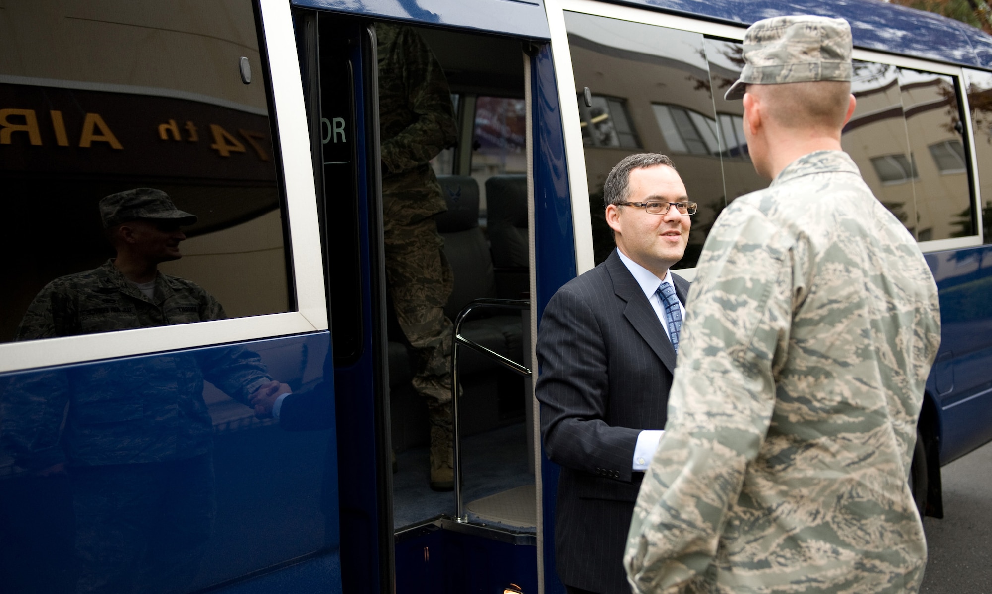 YOKOTA AIR BASE, Japan -- Col. Bill Knight, 374th Airlift Wing vice commander, greets Daniel Ginsberg, Assistant Secretary of the Air Force for Manpower and Reserve Affairs, during a visit to Yokota Air Base, Japan, Dec. 1, 2011. Ginsberg toured facilities throughout Yokota seeing the different programs throughout the 374th Airlift Wing Services provide in support of Airmen and their families currently stationed at Yokota. (U.S. Air Force Photo/Airman 1st Class Krystal M. Garrett)