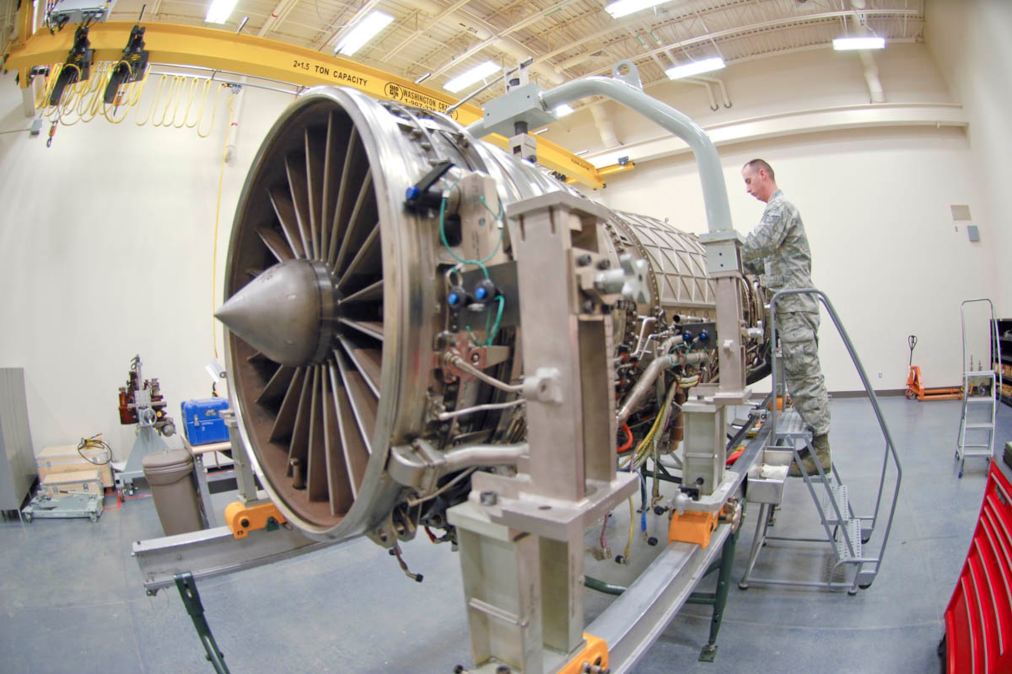 Tech.Sgt. Daniel Powers, from Edgewater, Florida, currently assigned to the 3rd Maintenance Squadron, Joint Base Elmendorf-Richardson, works on removing the upper fan duct from a F-119-100 "Raptor" F-22 engine. He is attending a 173 hour F-119 jet engine intermediate training course held at the 372nd Training Squadron, Detachment 14.