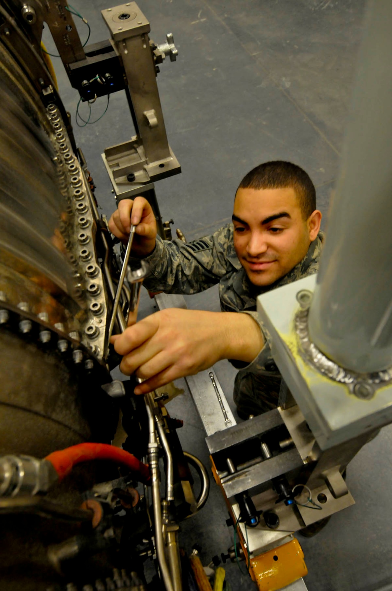 Air Force Staff Sgt Jose Caballero, from Springfield, Massachusets, works on the F-119-100 Pratt-Whitney engine for a F-22 "Raptor" fighter. Caballero is assigned to 3rd Maintenance Squadron at Joint Base Elmendorf-Richardson. He is attending a training course at the 372nd Training Squadron/Detachment 14. The class length is 173 hours, combining classroom and lab time, on the 10 million dollar engine