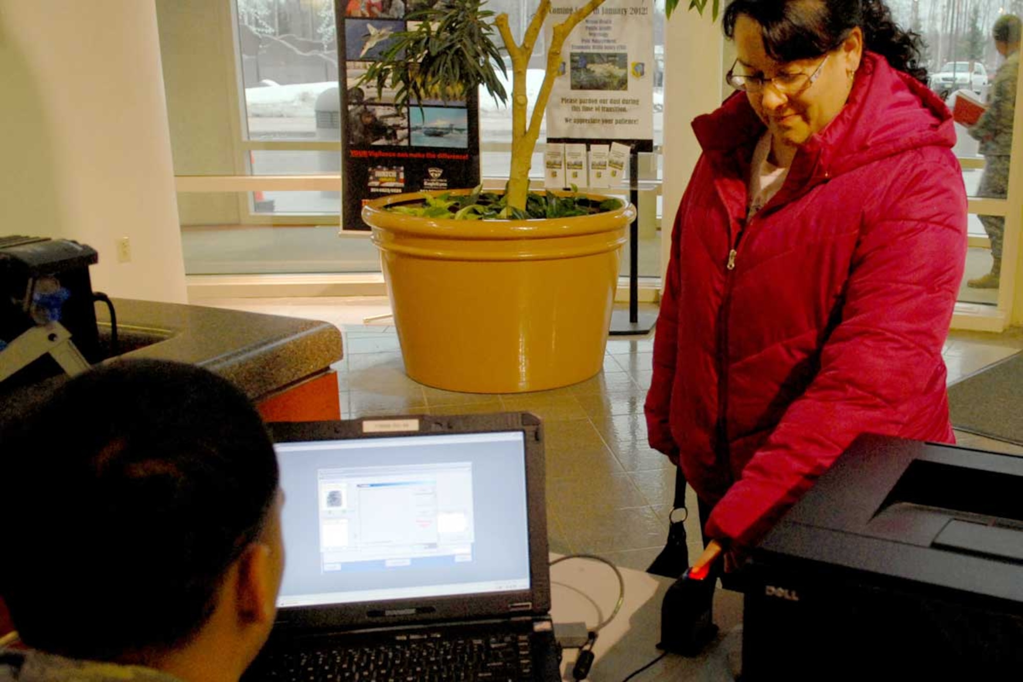 Quintana Luanner, a military family member at Joint Base Elmendorf-Richardson registers in the Defense Biometric Identification System at the JBER hospital. The DBIDS registration deadline is Jan. 12. (U.S. Air Force photo/Senior Airman Jack Sanders)
