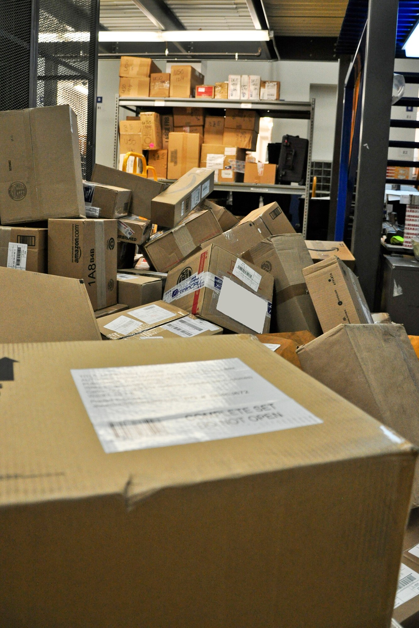 A pile of boxes sit and wait to be sorted in the post office at Osan Air Base, Republic of Korea Dec. 6, 2011. The Military Postal Service Agency here processes about 3,000 pieces of mail a day during the holiday season. (U.S. Air Force photo/Tech. Sgt. Chad Thompson)