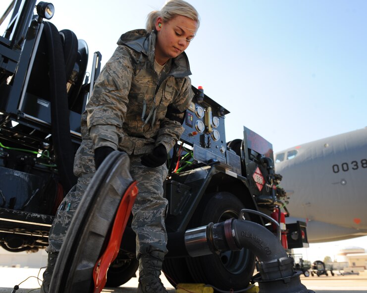 Airman 1st Class Rachel Rodgers, 2nd Logistics Readiness Squadron fuel distribution operator, closes the hatch to a fuel pit on Barksdale Air Force Base, La., Dec. 7. R-12 fuel trucks are designed to extract jet fuel from fuel pits located beneath the flightline to the awaiting aircraft. (U.S. Air Force photo/Airman 1st Class Micaiah Anthony)(RELEASED)