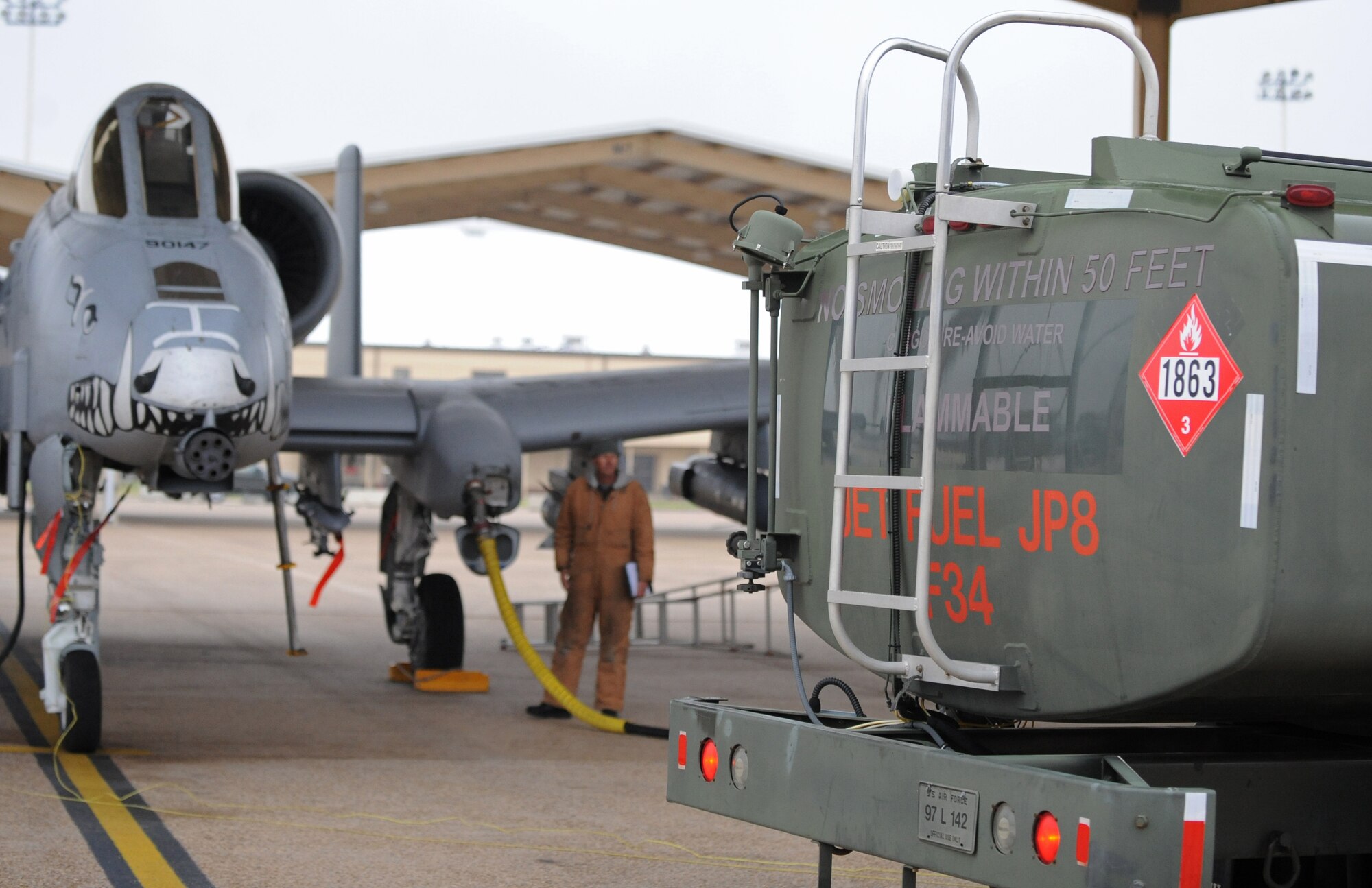 Staff Sgt. Shannon Tutt, 917th Aircraft Maintenance Squadron, ensures fuel flows safely from an A-10 Thunderbolt II back to an R-11 fuel truck on Barksdale Air Force Base, La., Dec. 6. Before an aircraft can defuel, the fuel must be tested to prevent further contamination. R-11 fuel trucks are capable of storing 6,000 pounds of fuel. (U.S. Air Force photo/Airman 1st Class Micaiah Anthony)(RELEASED)