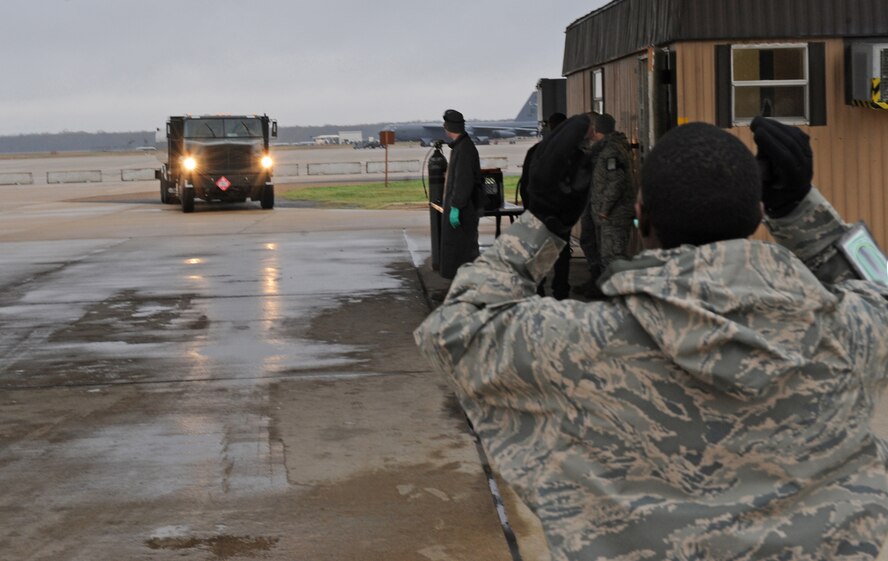 Airman Gregory Parish, 2nd Logistics Readiness Squadron fuels apprentice, guides Senior Airman Gregory Presley, 2 LRS fuels distributor, into the inspection area on Barksdale Air Force Base, La., Dec. 6. Inspections are conducted daily to ensure all fuel trucks are ready and safe to use. (U.S. Air Force photo/Airman 1st Class Micaiah Anthony)(RELEASED)