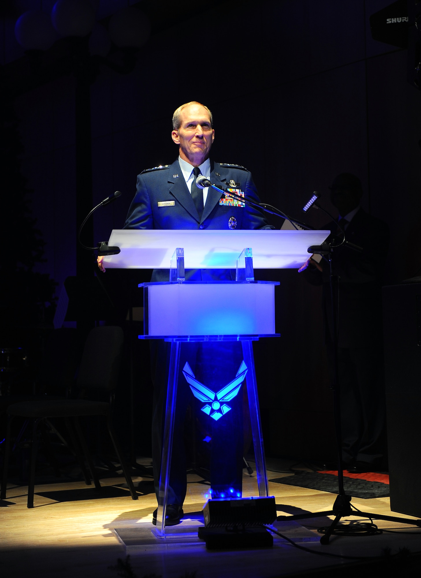 U.S. Air Force Gen. Mike Hostage, commander of Air Combat Command, greets patrons attending the 25th anniversary of the Heartland of America Band's holiday show at the Holland Performing Arts Center in Omaha, Neb., Dec. 7.  Besides attending the concert, Hostage spent two days visiting Airmen and touring facilities at Offutt Air Force Base, Neb.  (U.S. Air Force Photo by Josh Plueger/Released)