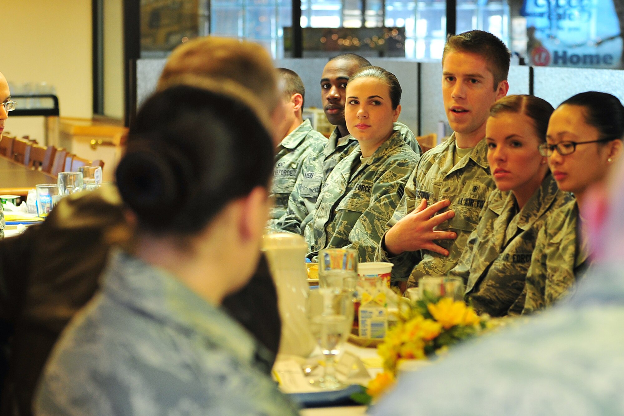 U.S. Air Force Airmen 1st Class David Bergstrom, 55th Medical Operations Squadron, asks U.S. Air Force Gen. Mike Hostage, commander of Air Combat Command, a question during breakfast at the Ronald L. King Dining facility on Offutt Air Force Base, Neb., Dec. 7. Hostage met with some of Team Offutt members to discuss the future of the Air Force. 

(U.S. Air Force Photo by Charles Haymond/Released).